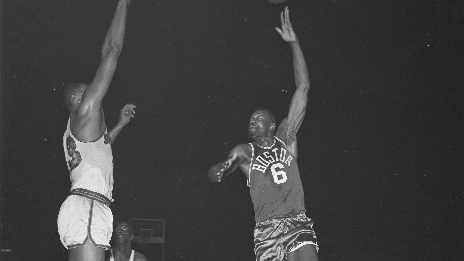 Wilt Chamberlain and Bill Russell in an NBA game from 1964.