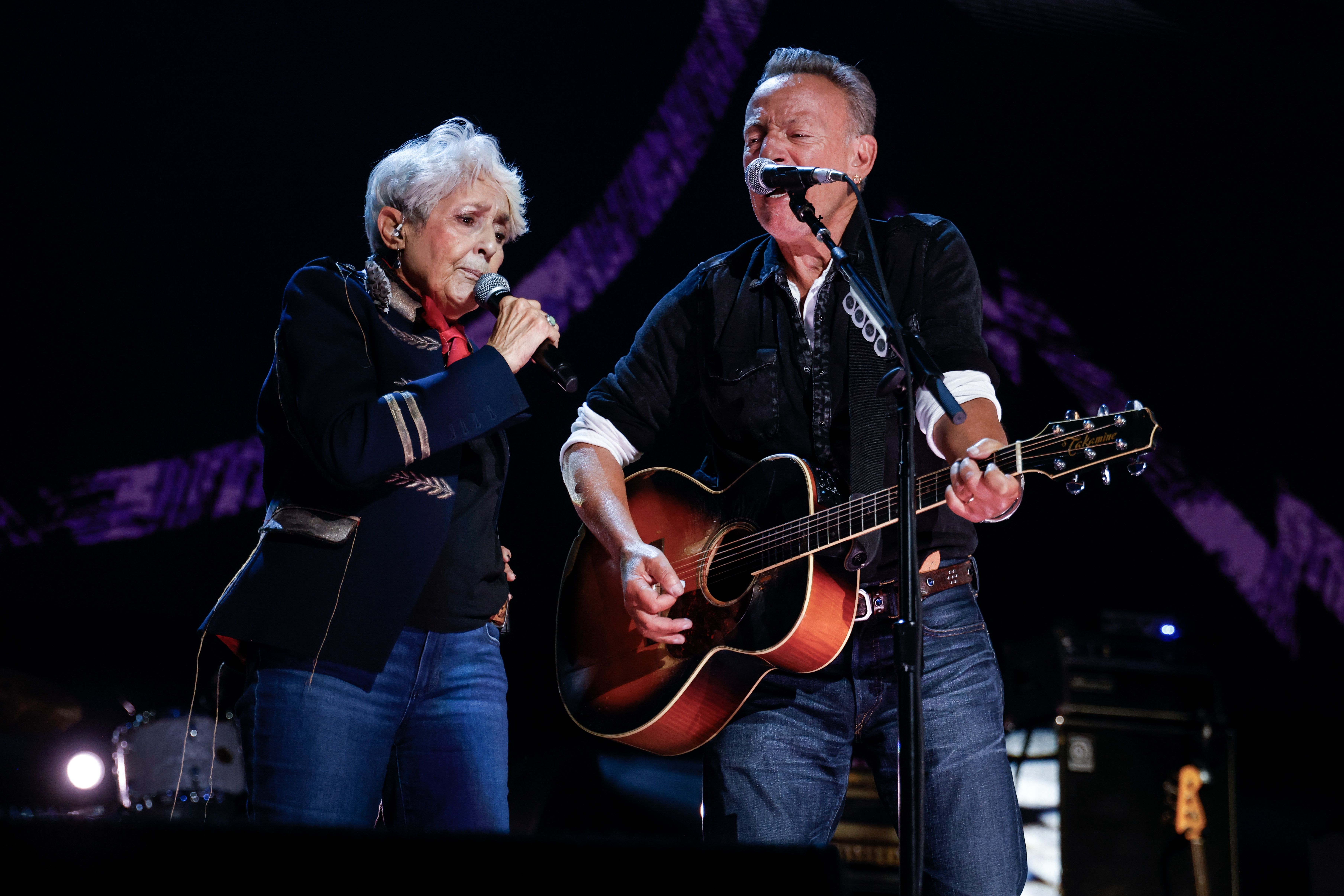 Joan Baez, left, and Bruce Springsteen perform during the Power To The People Festival on Saturday, Oct. 3, 2026, in Columbia, Md. (AP Photo/Alyssa Piazza)