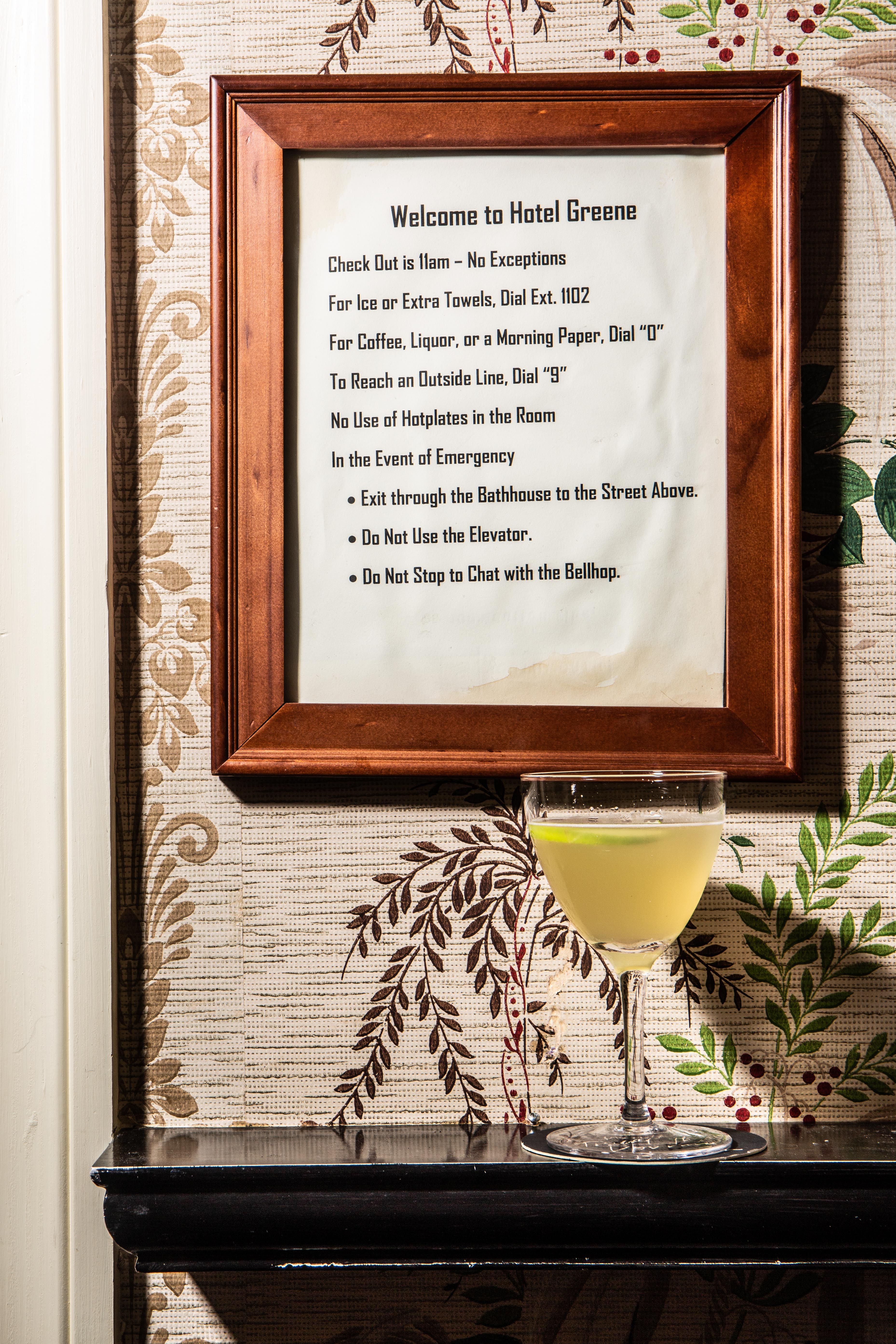 a restaurant sign that says welcome to hotel greene 