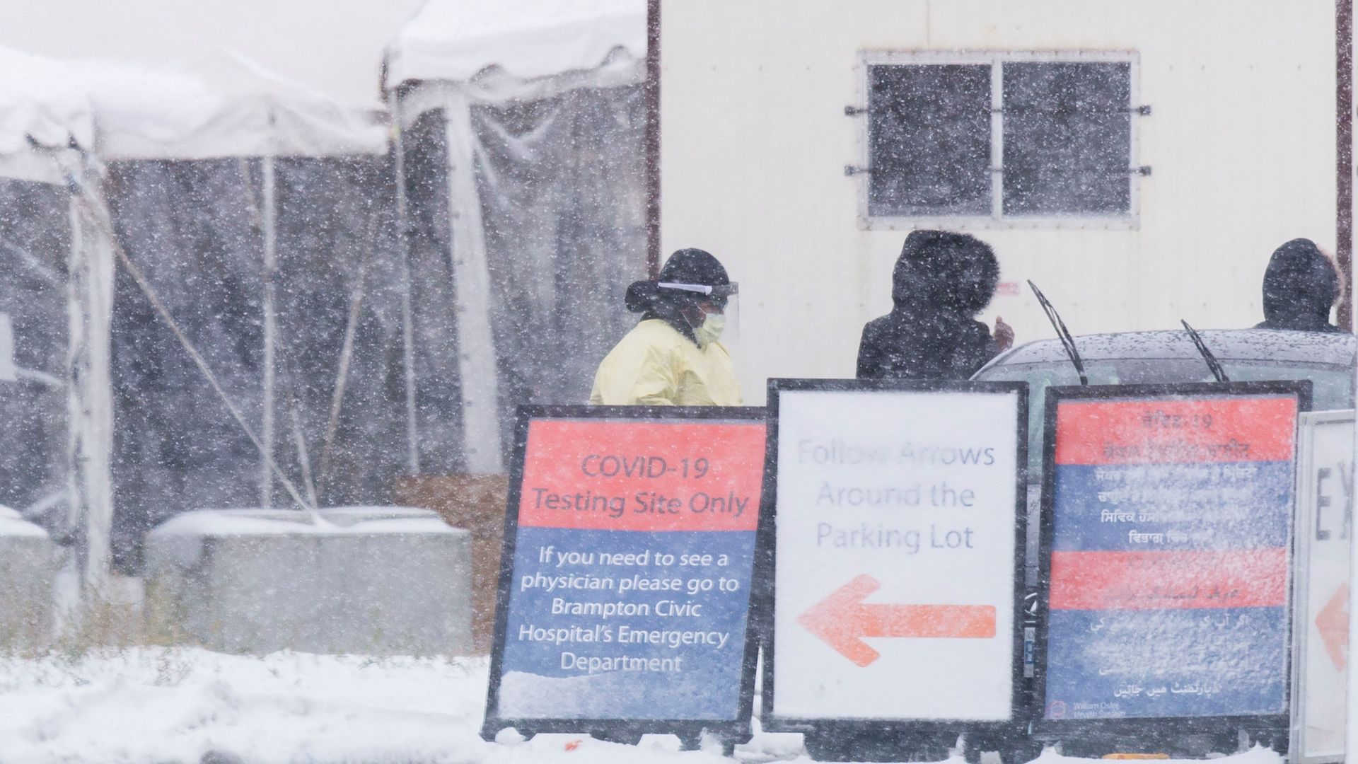  People arrive at a COVID-19 assessment center in Brampton, Ontario, Canada, on Dec. 1