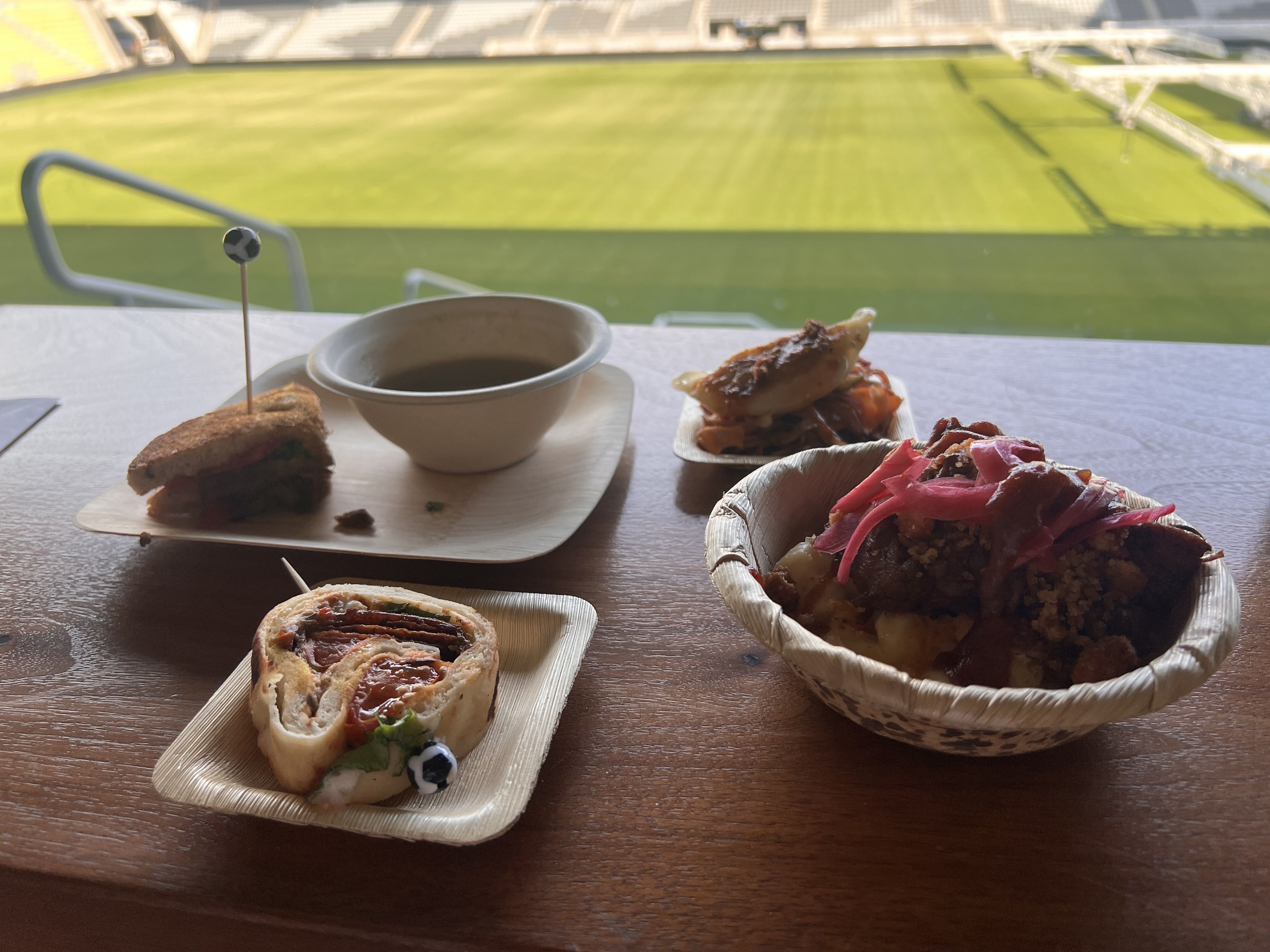 New Columbus Crew food options sit in front of the field