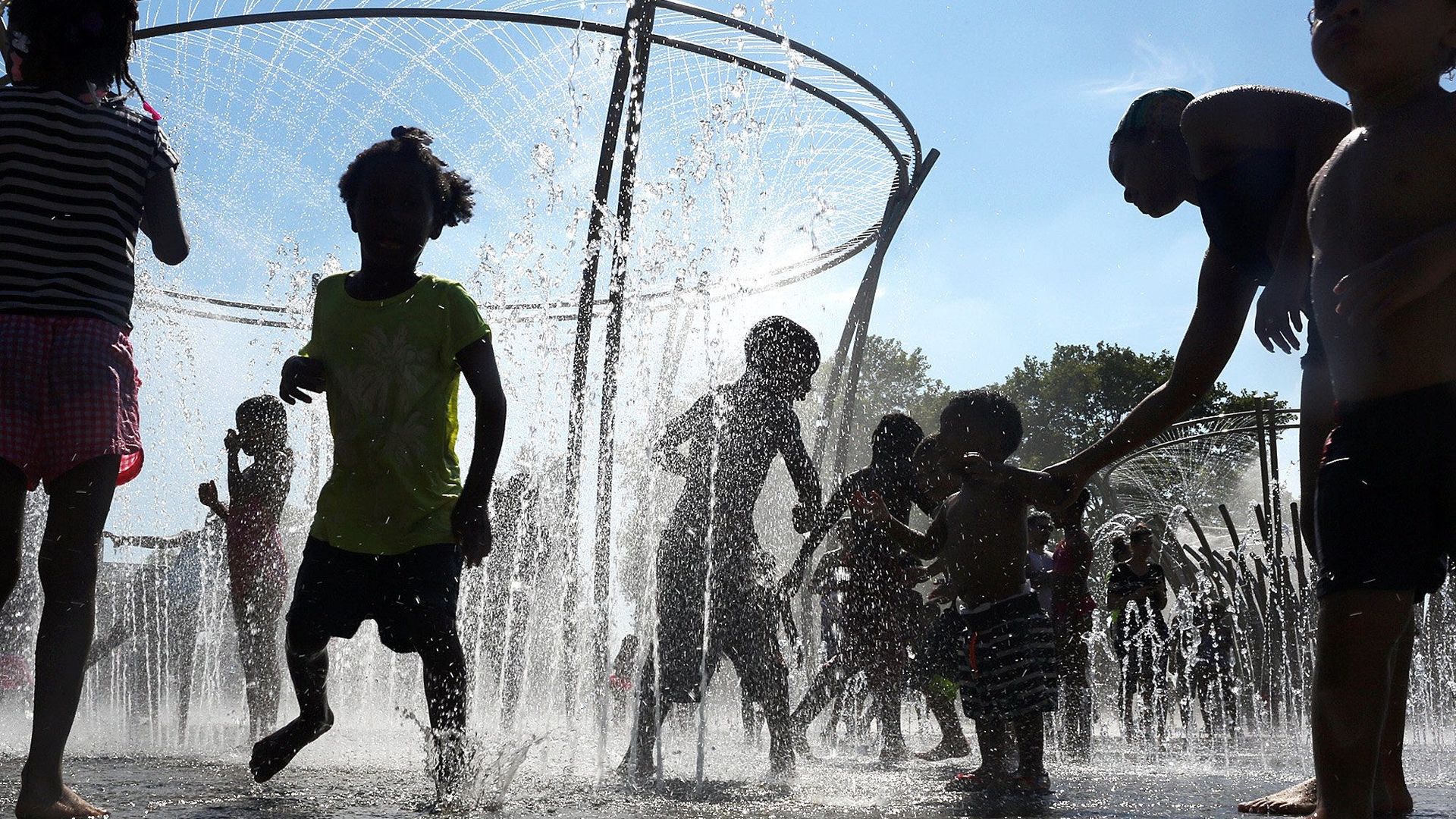 Families enjoying a splash park.