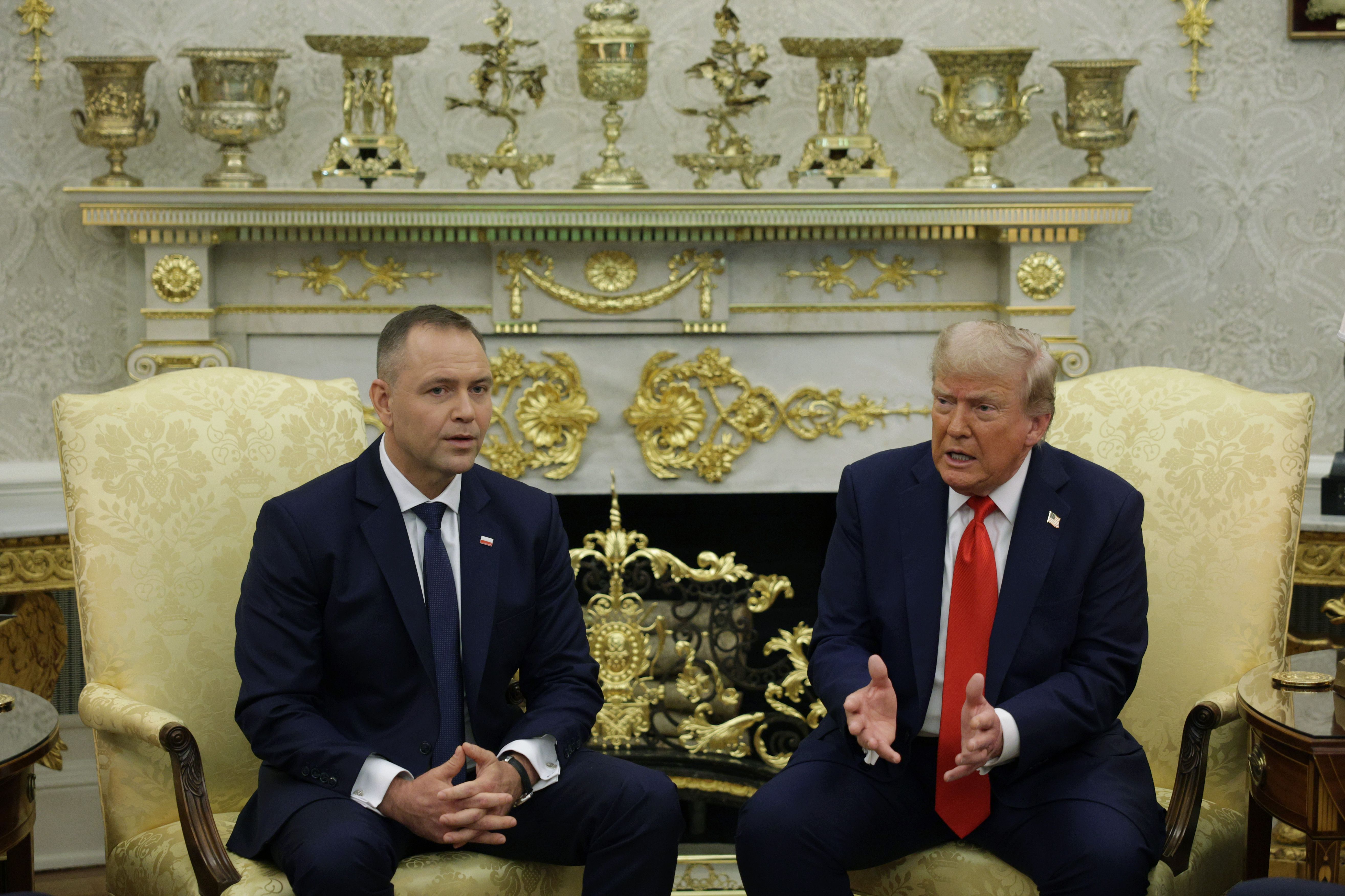 Two men in suits in oval office