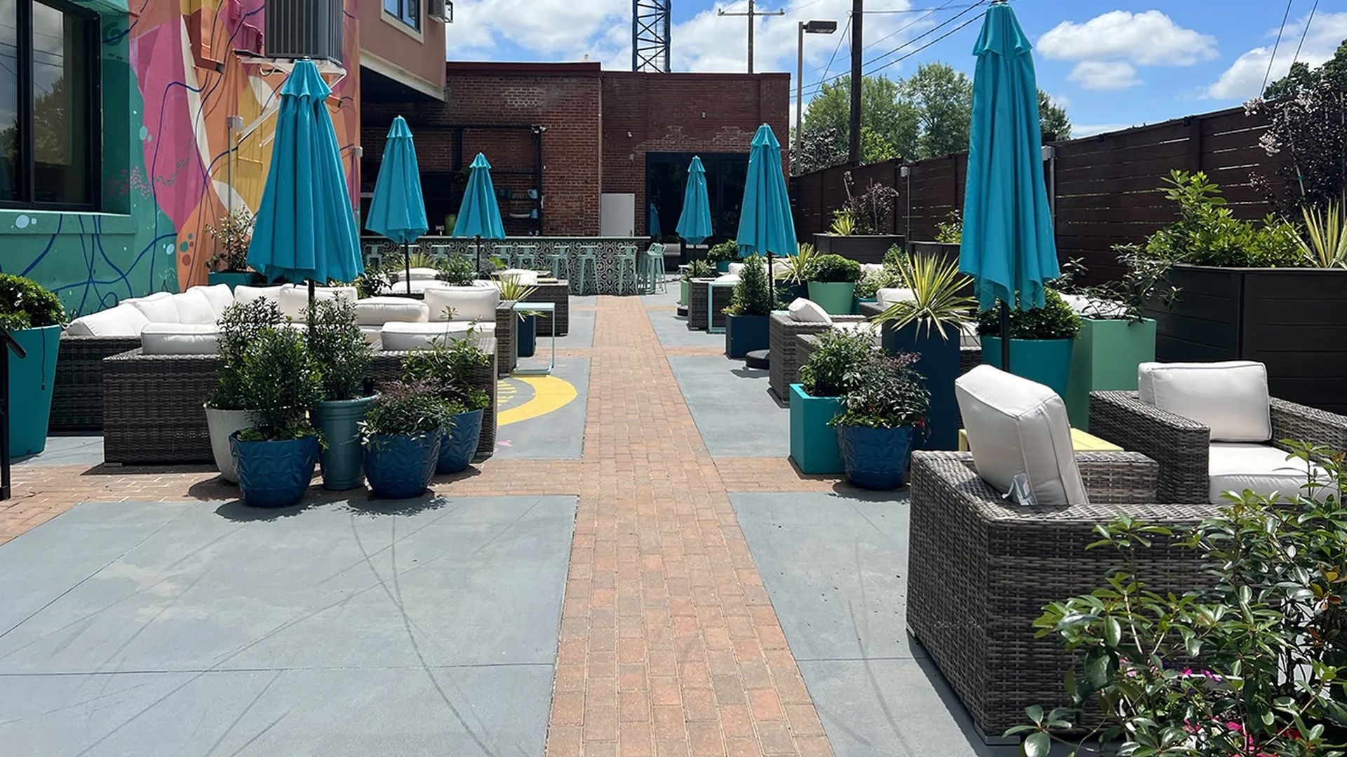 Outside bar patio with umbrellas and lounge chairs