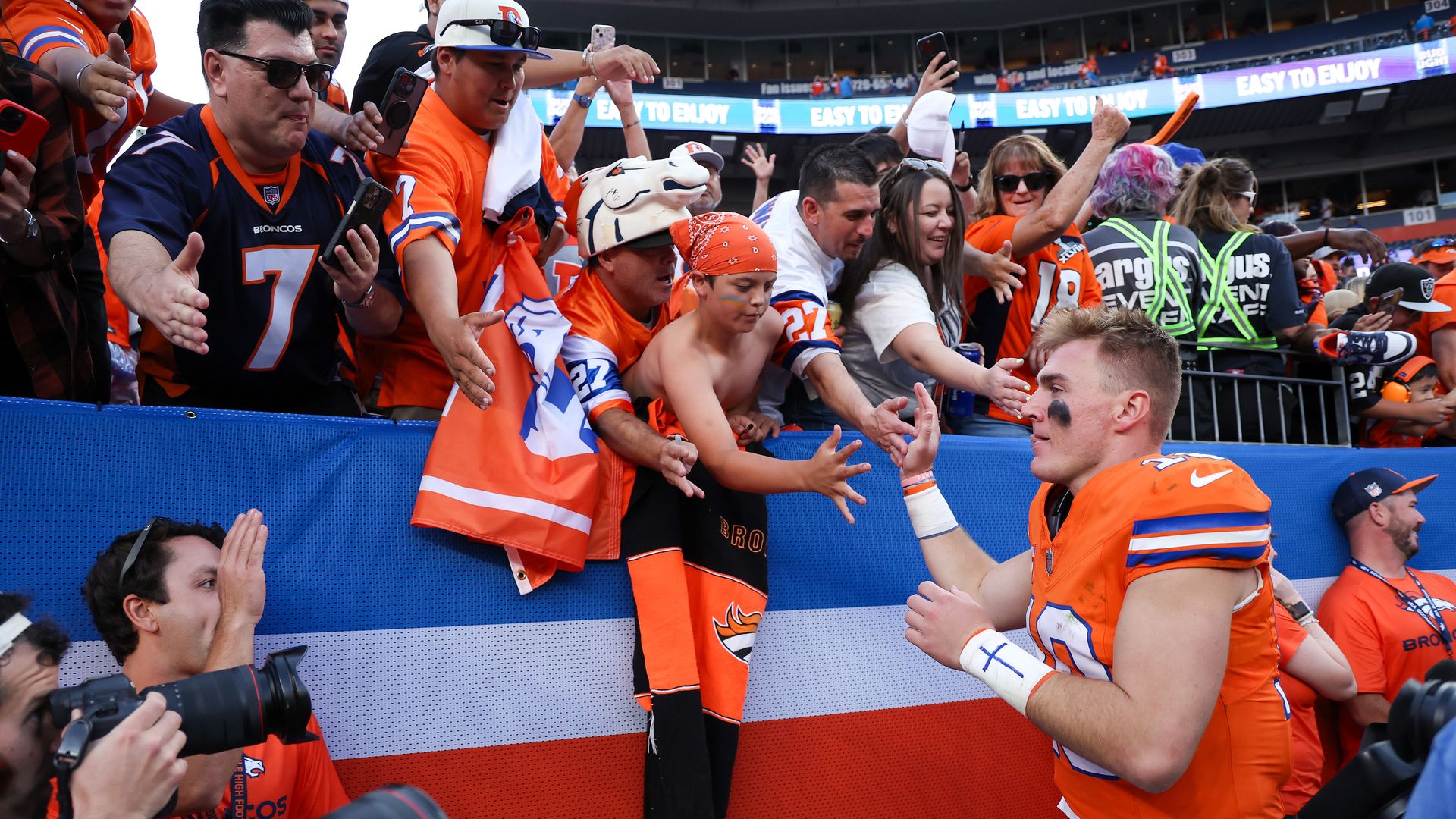 Bo Nix #10 of the Denver Broncos is congratulated by fans after their 34-18 win over the Las Vegas Raiders at Empower Field At Mile High on October 06, 2024 in Denver, Colorado. 