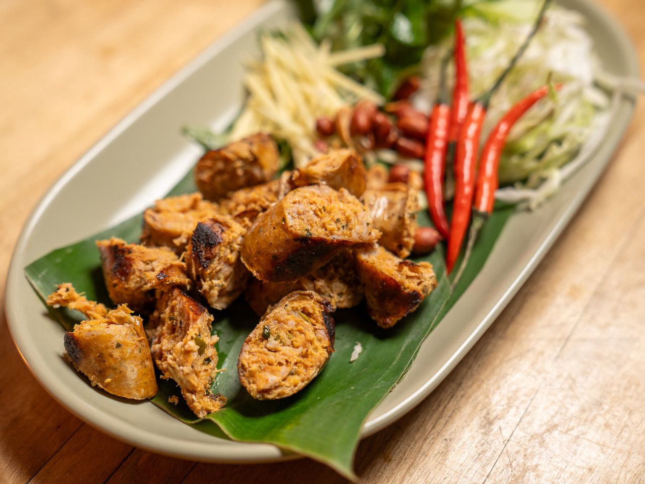 Sausage on a plate with chilies 