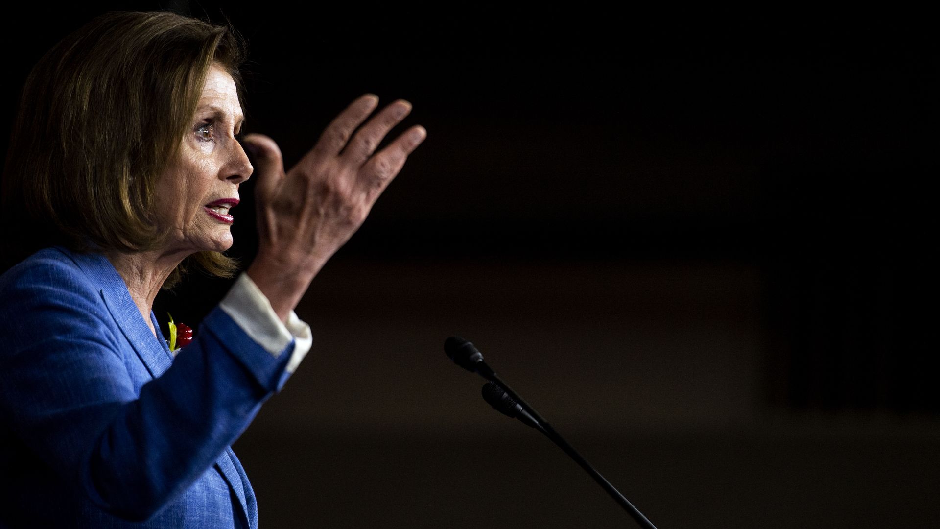 This image shows a profile of Nancy Pelosi speaking.