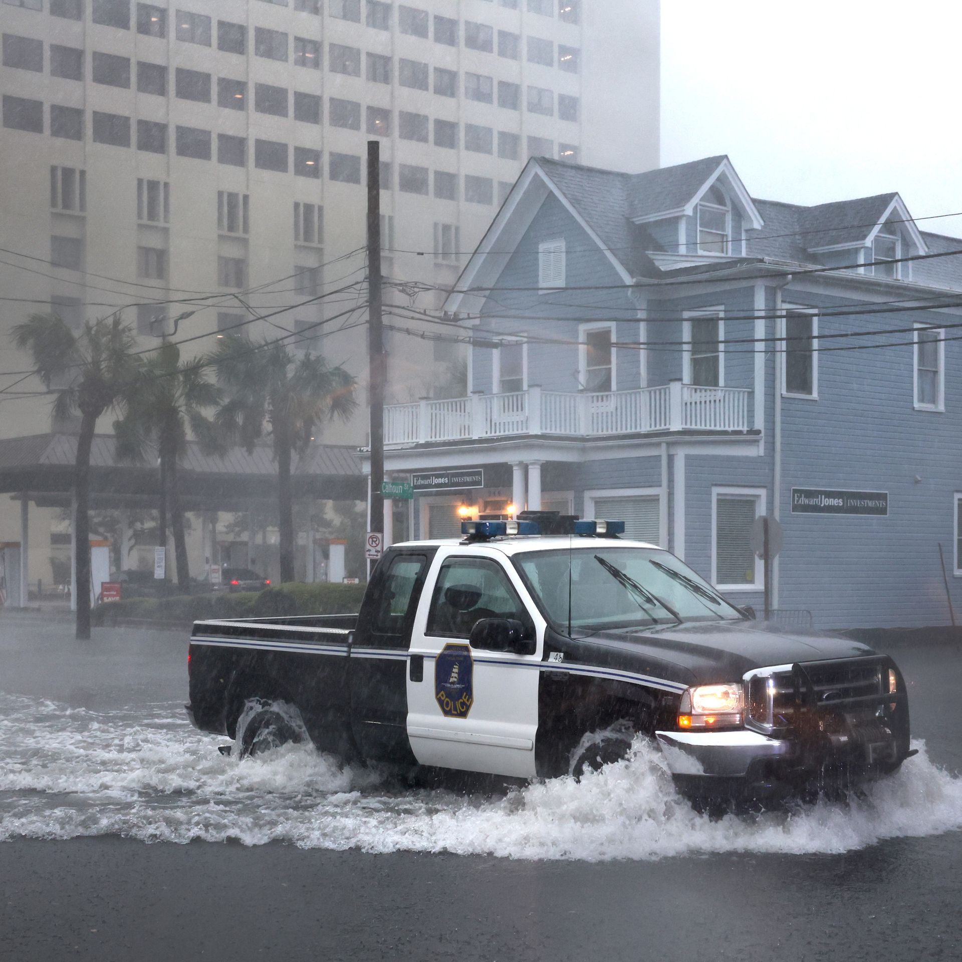 A police vehicle driving down a flooded street in Charleston, South Carolina, on Sept. 30.