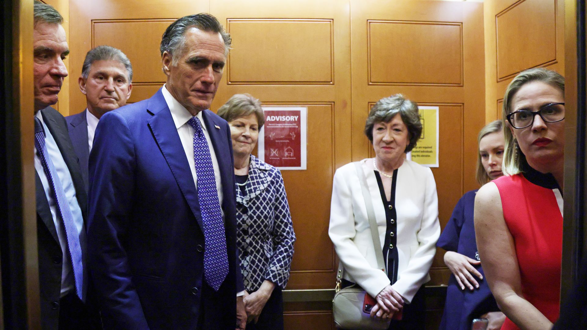 U.S. Sens. Mark Warner (D-VA), Joe Manchin (D-WV), Mitt Romney (R-UT), Jeanne Shaheen (D-NH), Susan Collins (R-ME) and Kyrsten Sinema (D-AZ) take a break from a meeting on infrastructure 