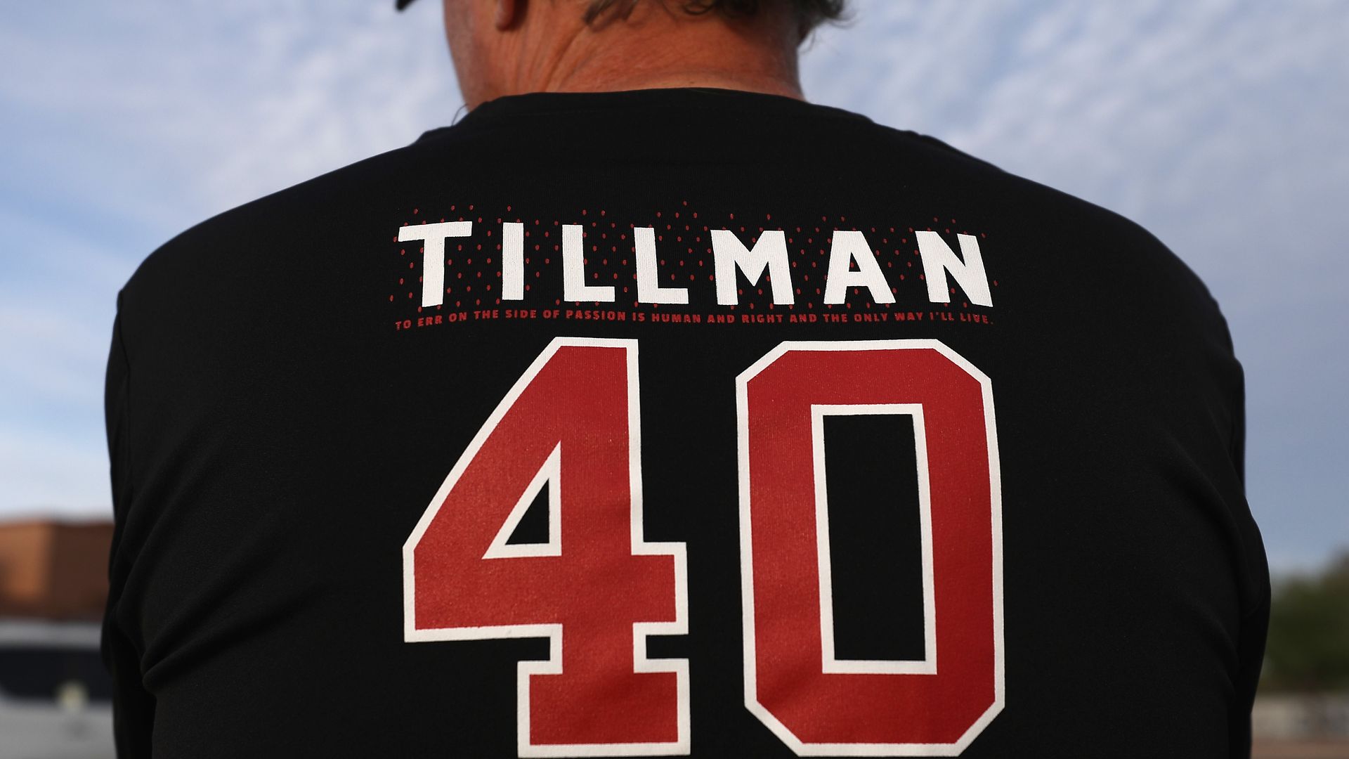 The back of a man's shirt that says, "Tillman 40."