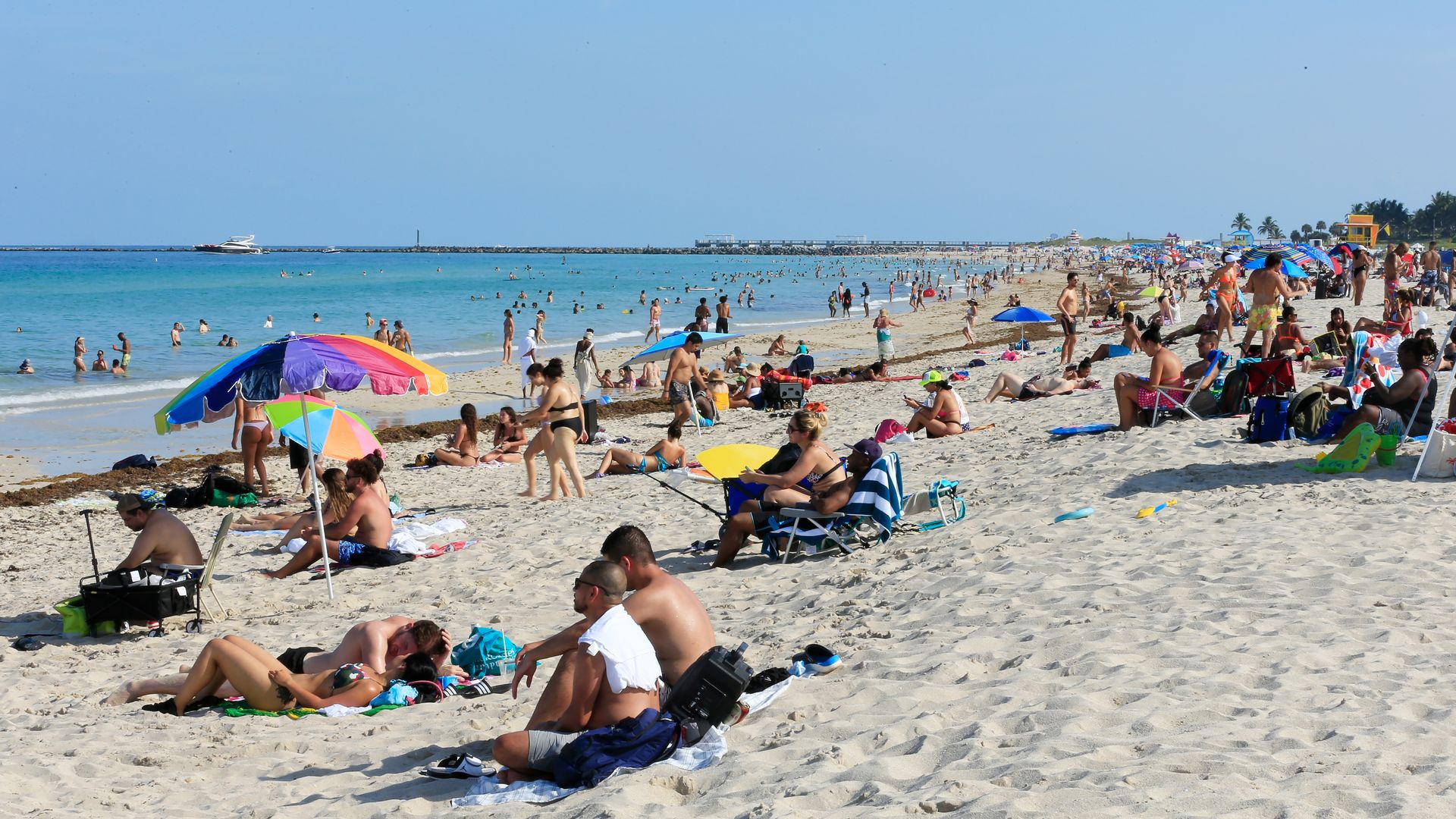 People sit on the beach