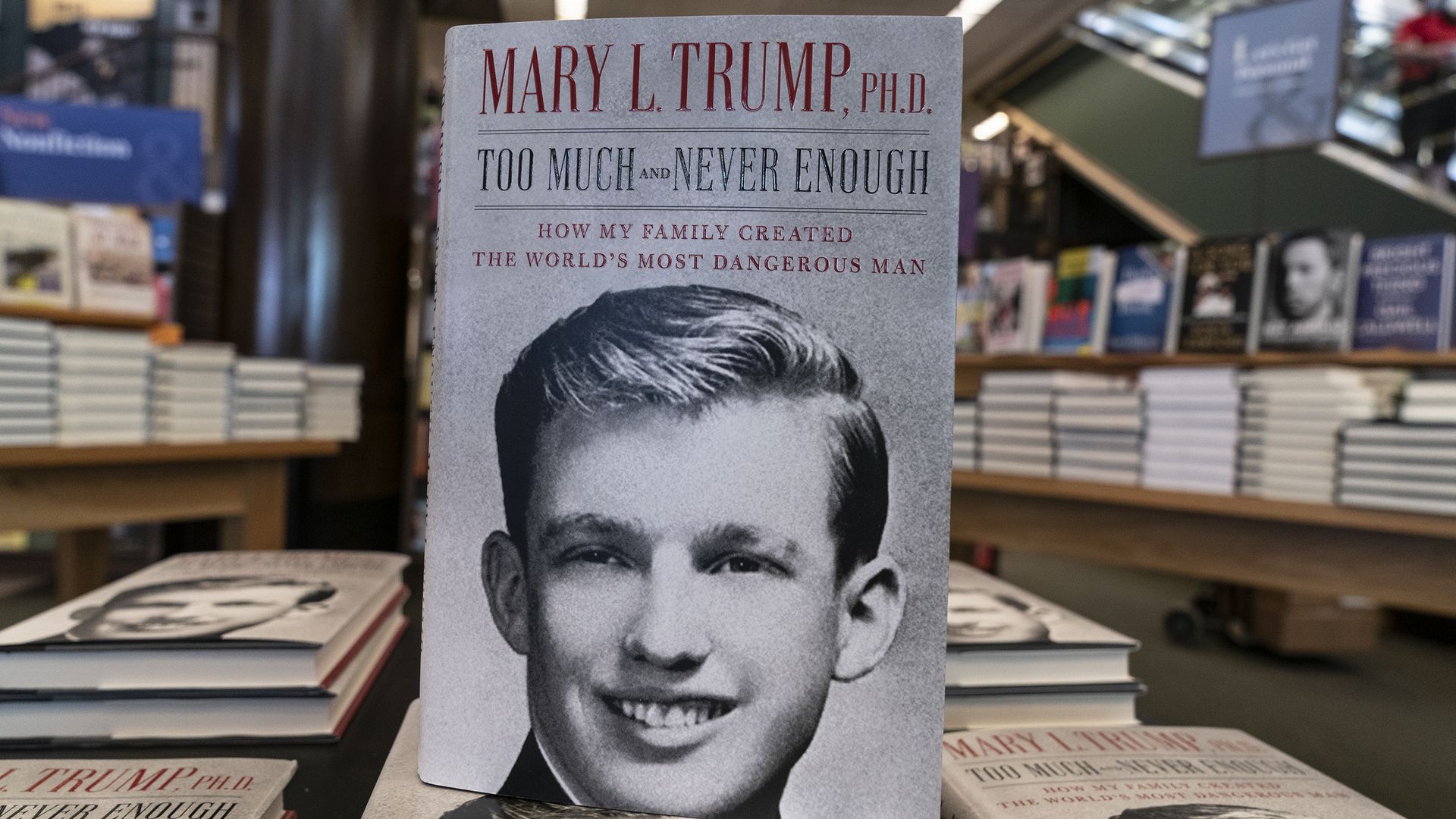 Mary Trump's book is propped on top of a larger stack of books 