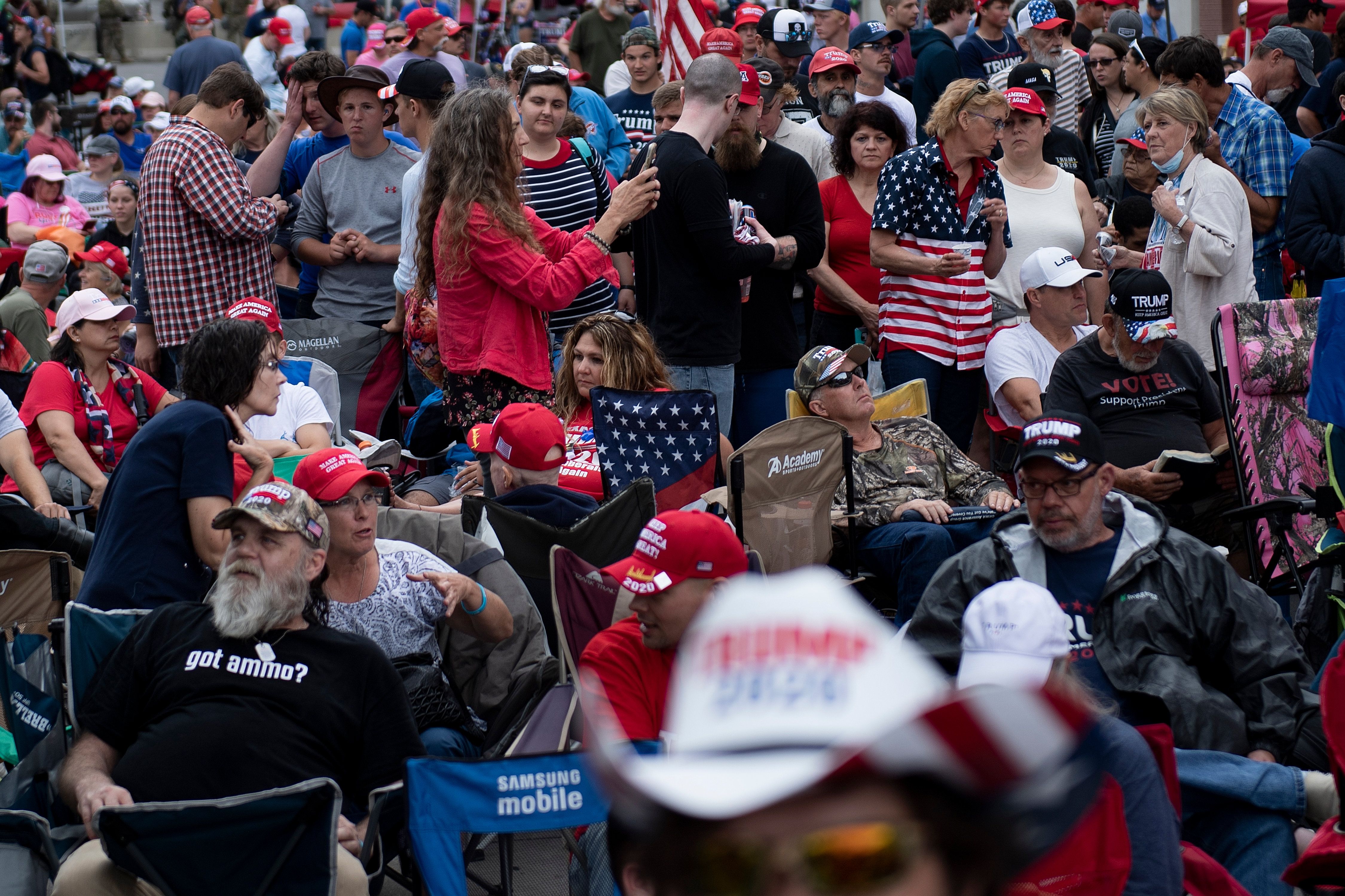 A crowd of people wearing a lot of American flag apparel 