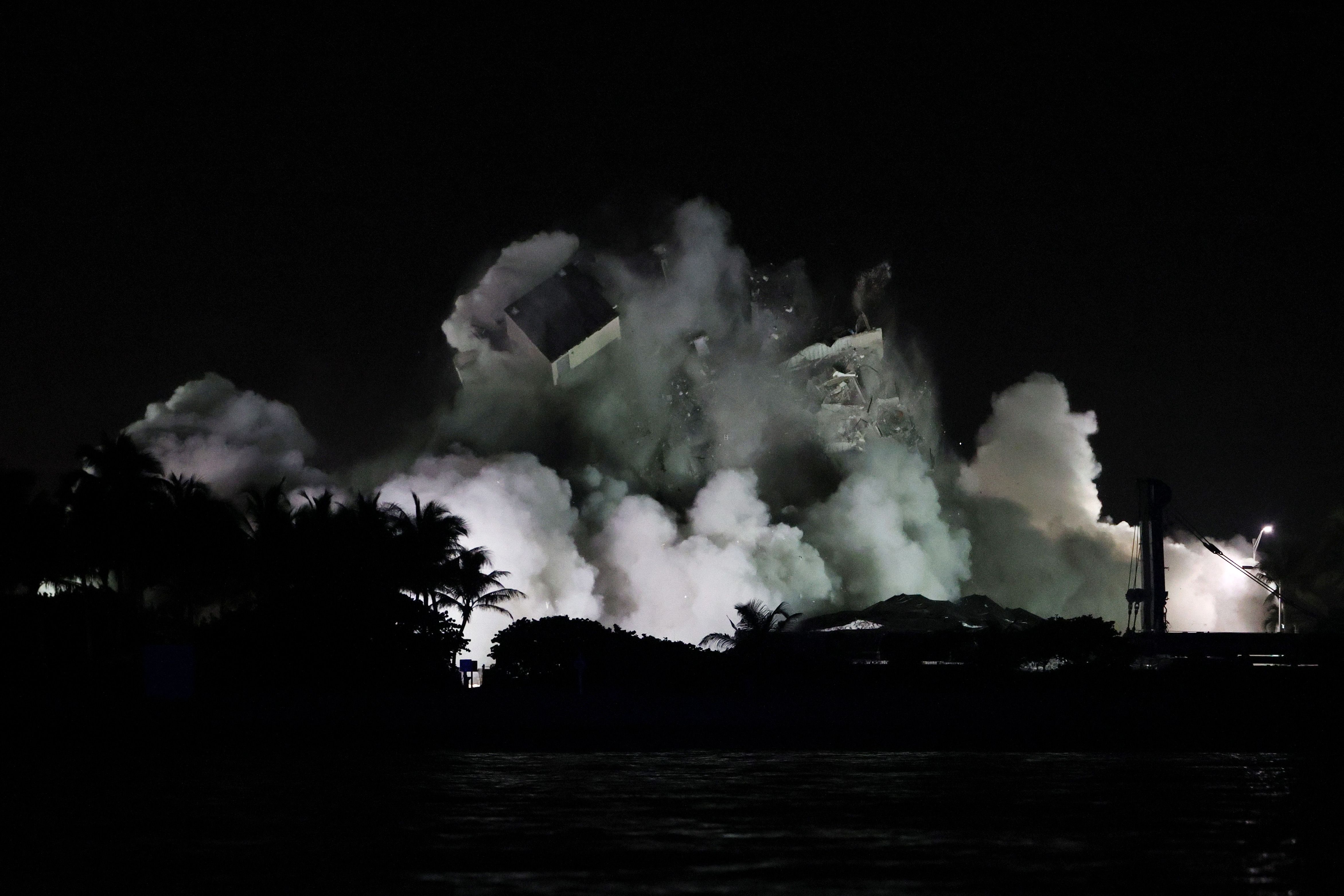  The remaining part of the partially collapsed 12-story Champlain Towers South condo building falls with a controlled demolition on July 4, 2021 in Surfside, Florida. 