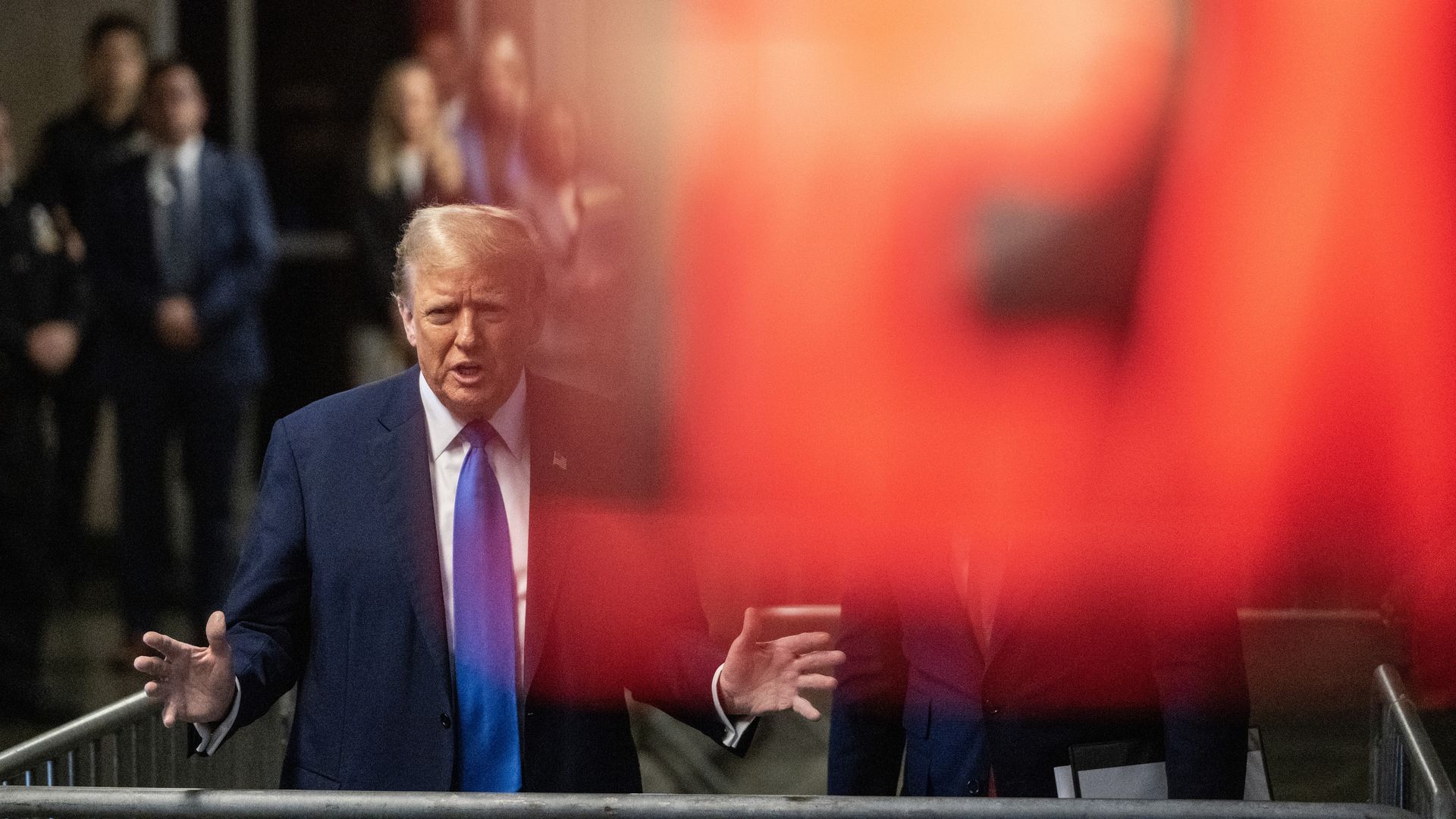 Former U.S. President Donald Trump speaks to the media as he leaves court with his attorney Todd Blanche during his trial for allegedly covering up hush money payments at Manhattan Criminal Court on April 22, 2024 in New York City.
