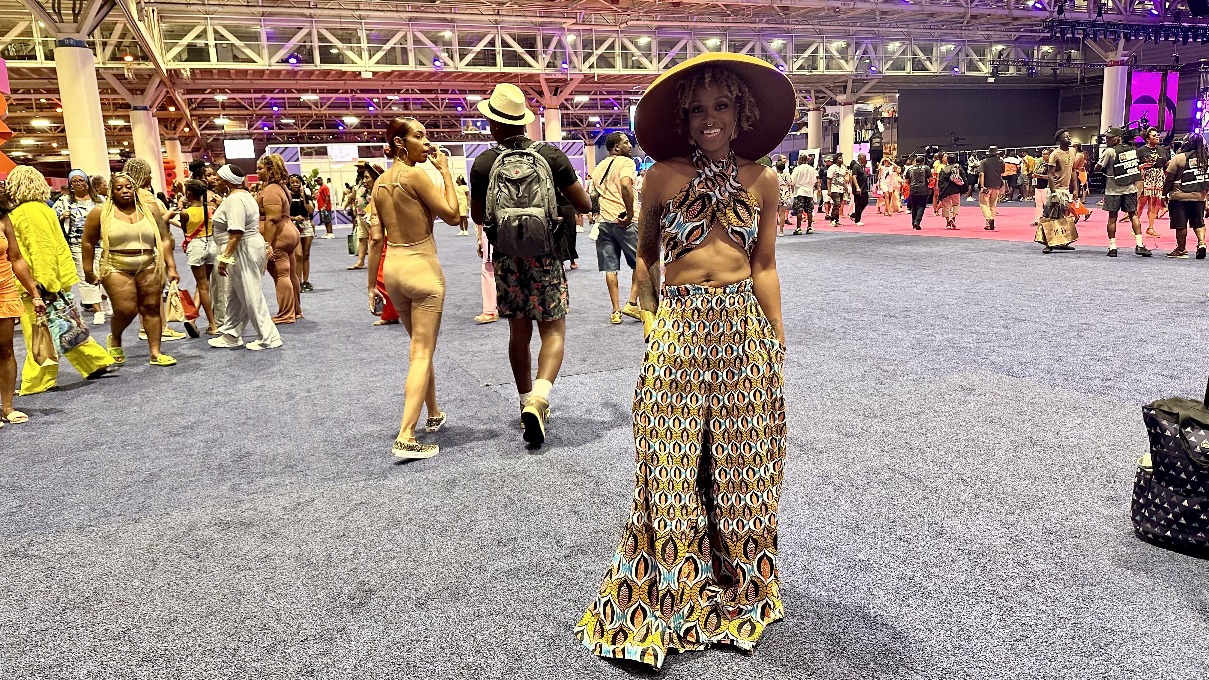 Photo shows a woman in a cool outfit with a hat.