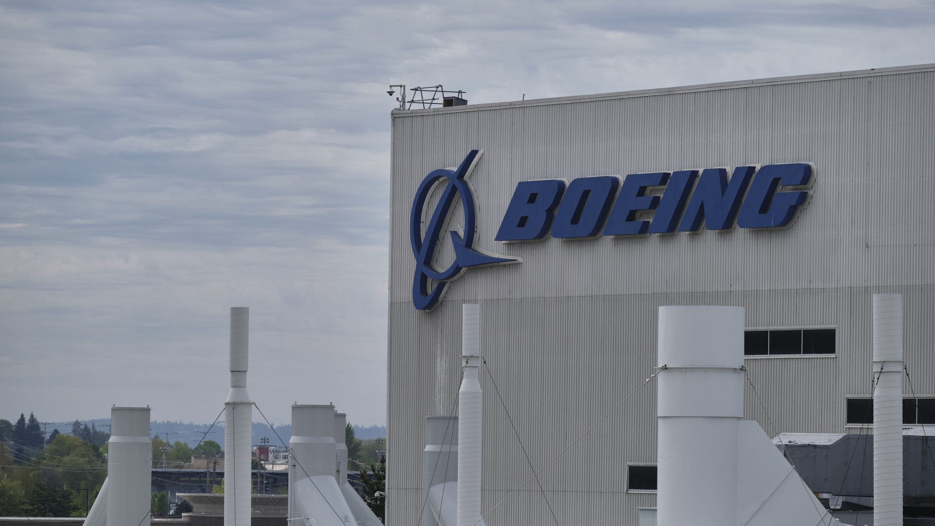In this image, the Boeing logo is visible on the side of a building