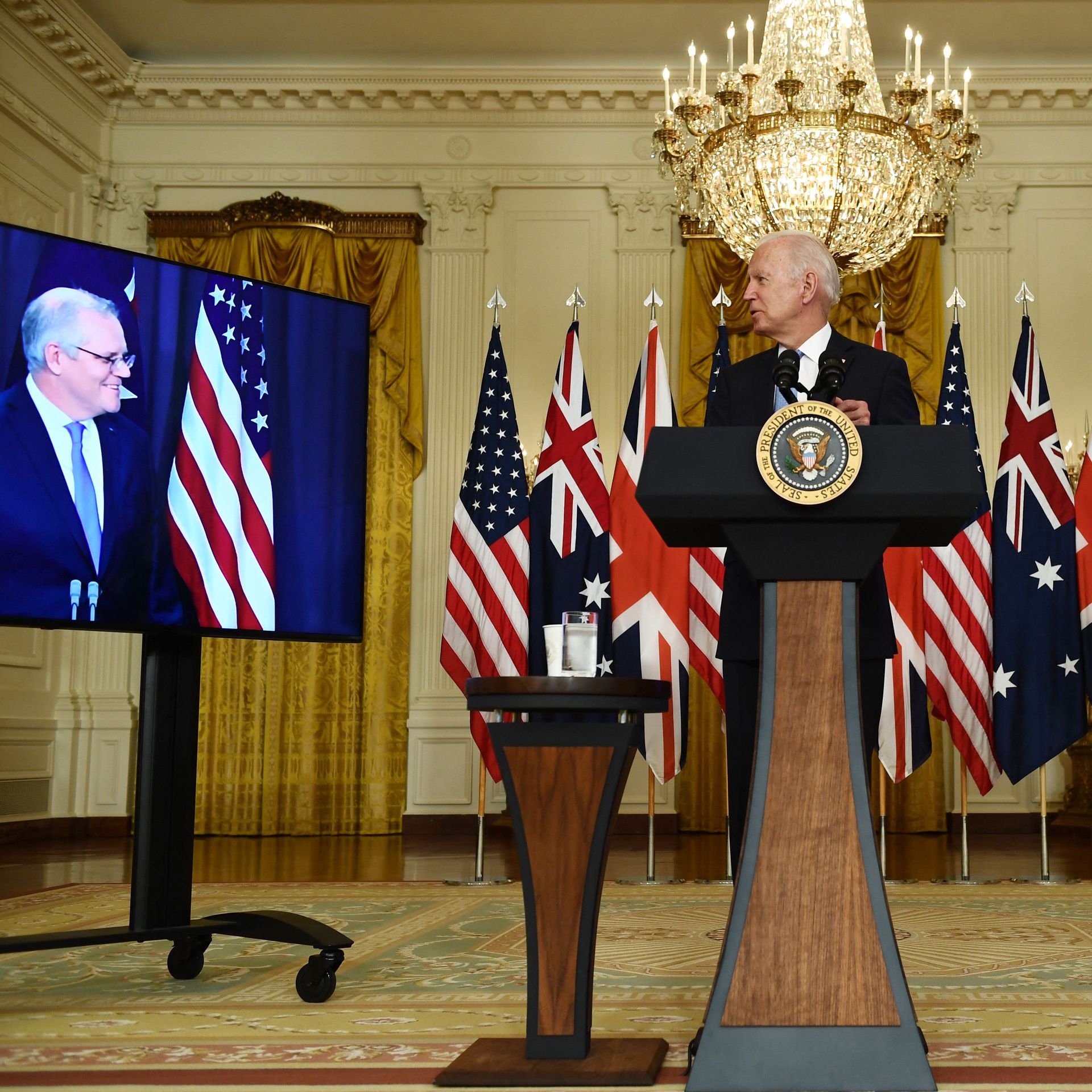 President Biden is seen looking at Australia Prime Minister Scott Morrison during press statements with British Prime Minister Boris Johnson.