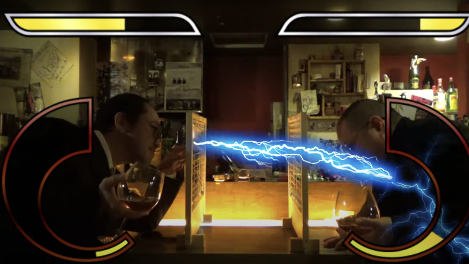 Video still of two people facing off in a bar, drinks in hand, as one seems to shoot electricity through some blinds, at the other