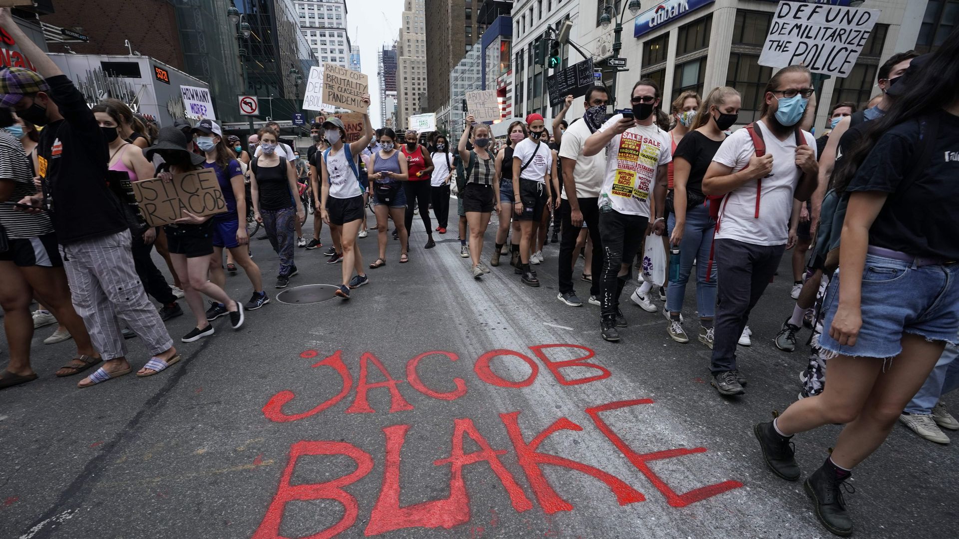 Demonstrators march through the city during a protest in New York August 24