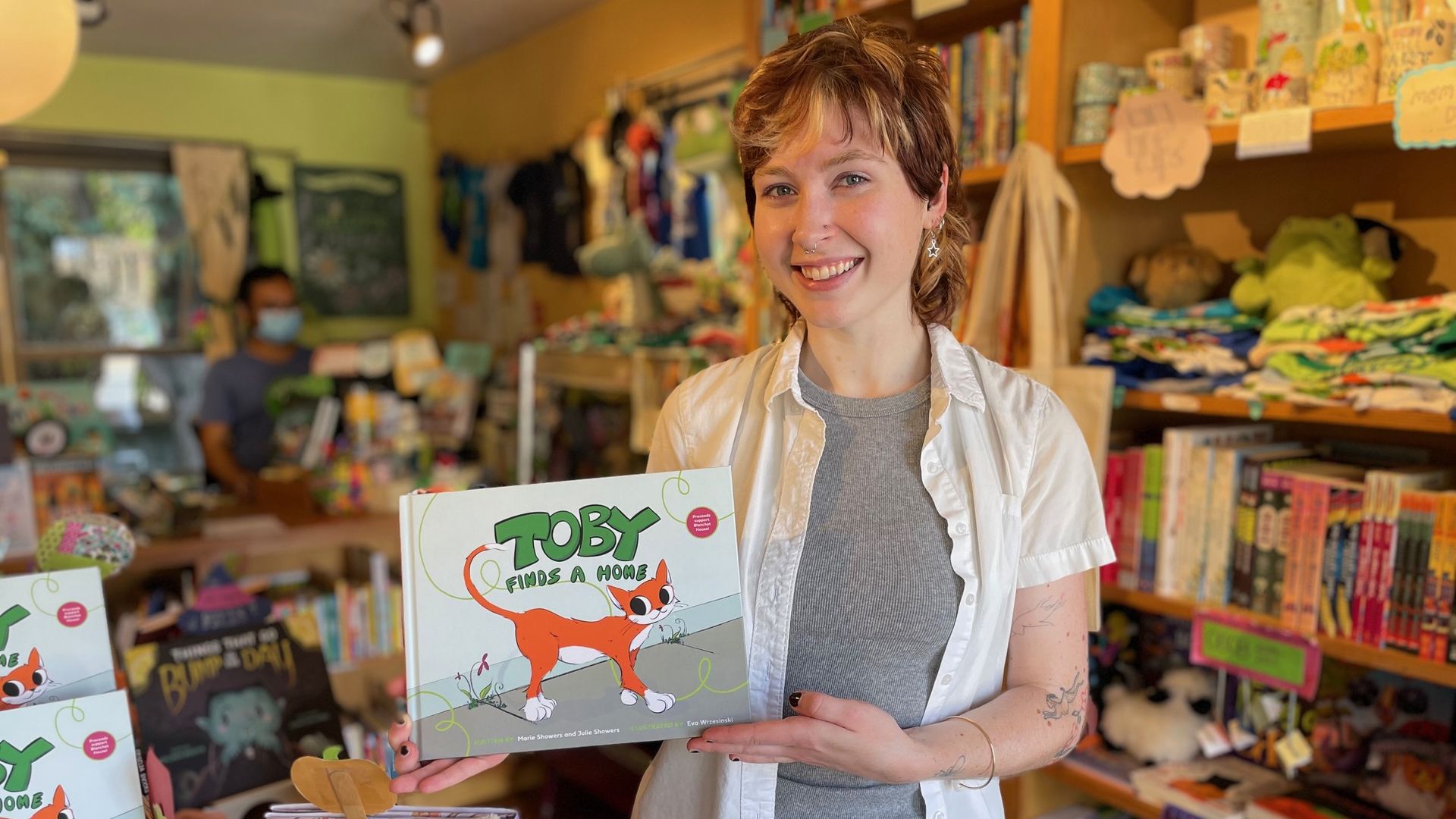 A photo of a person holding a book with the title 