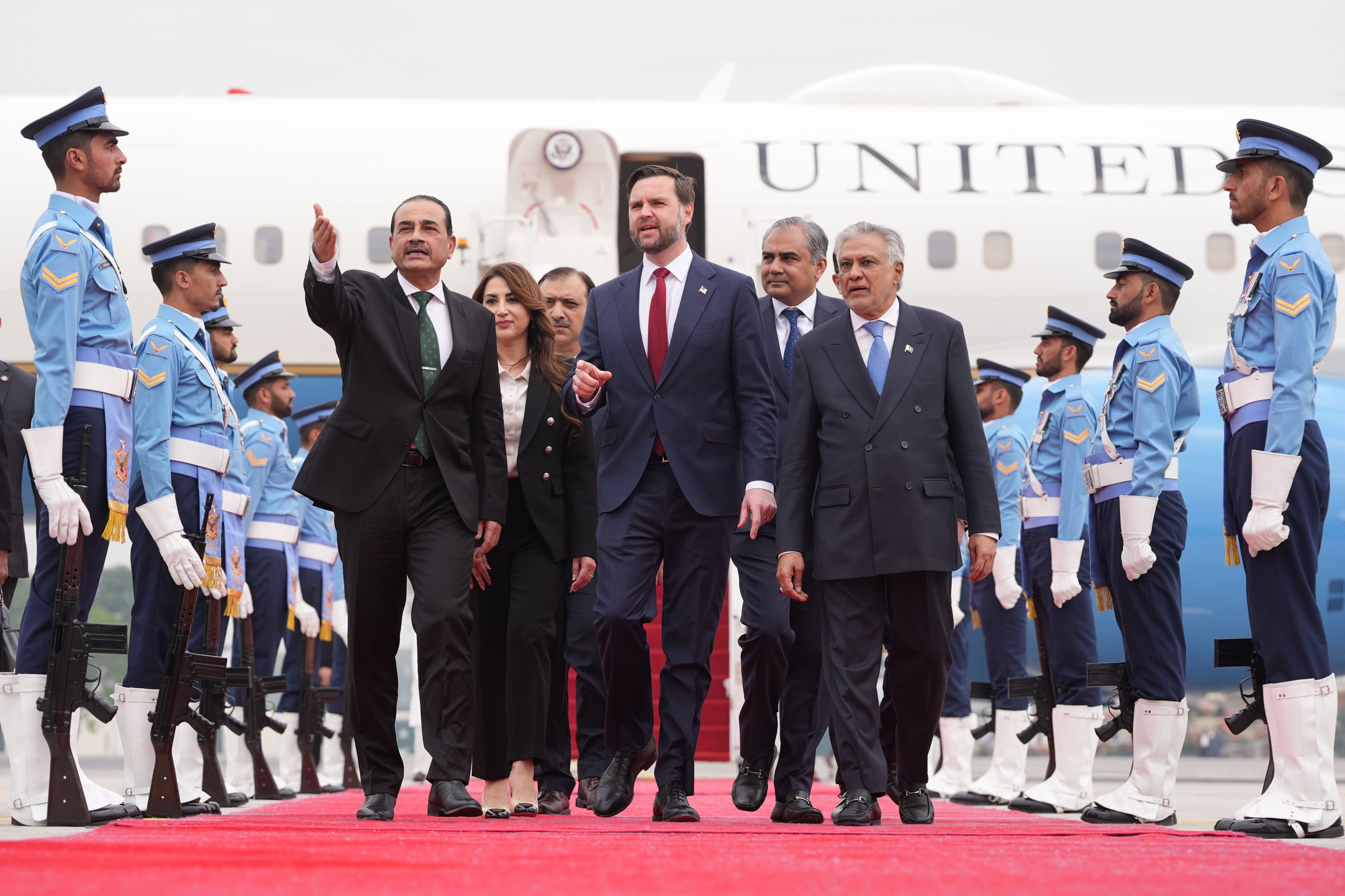 U.S. Vice President JD Vance, center, walks with Pakistan's Chief of Defence Forces and Chief of Army Staff Field Marshall Asim Munir, left, and Pakistani Deputy Prime Minister and Foreign Minister Mohammad Ishaq Dar after arriving for talks with Iranian officials in Islamabad, Pakistan, Saturday, A