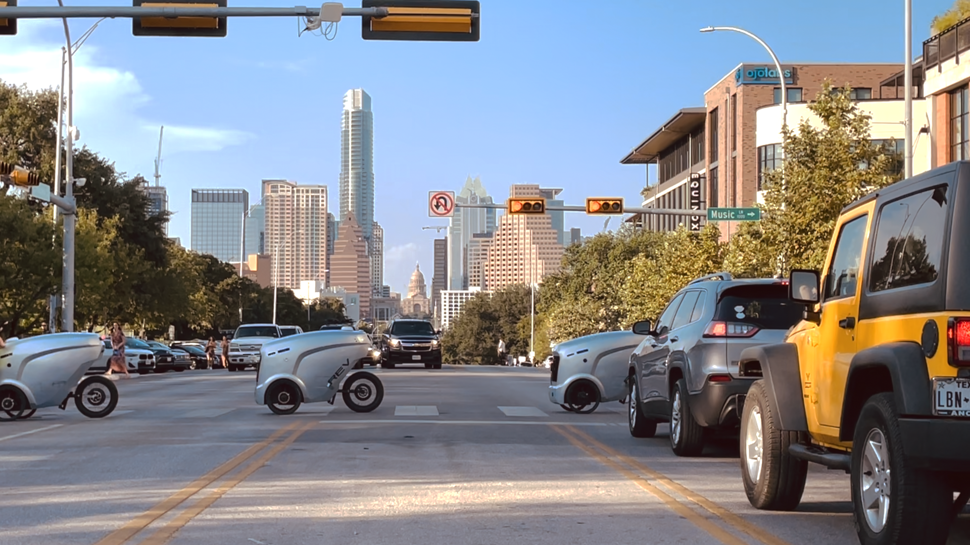 A team of Refraction bots crosses an Austin, Tex. intersection.