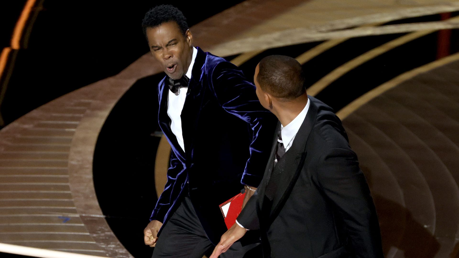 Will Smith appears to slap Chris Rock onstage during the 94th Annual Academy Awards at Dolby Theatre on March 27, 2022 in Hollywood, California. 