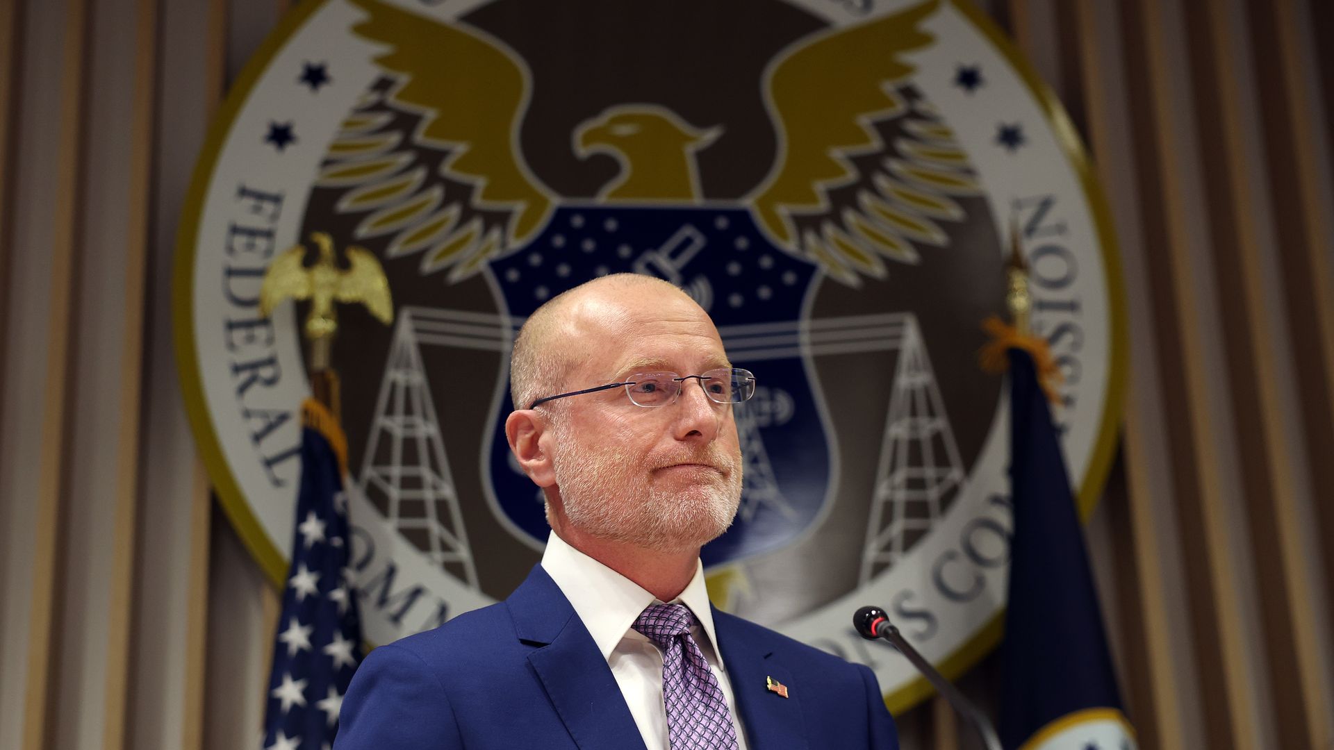 FCC Chairman Brendan Carr at a podium in front of the FCC seal