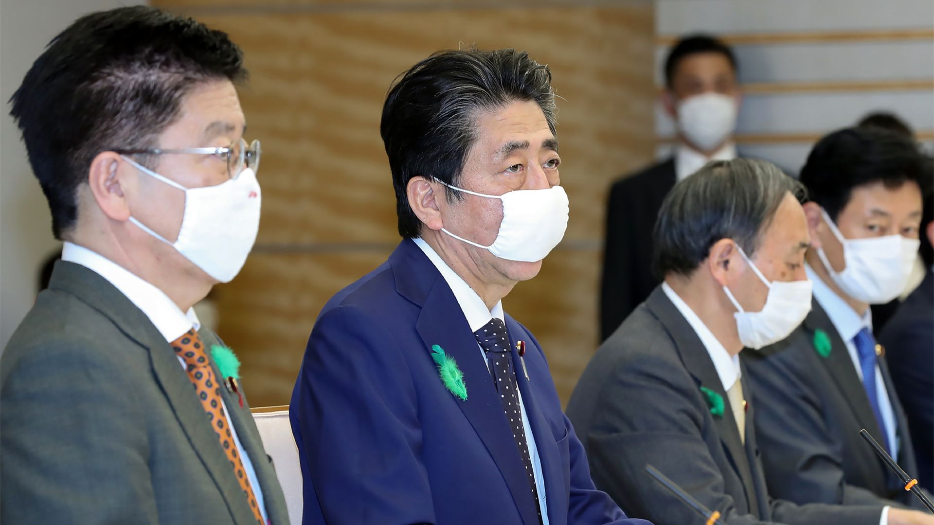 Japan's Prime Minister Shinzo Abe (2nd L), wearing a face mask