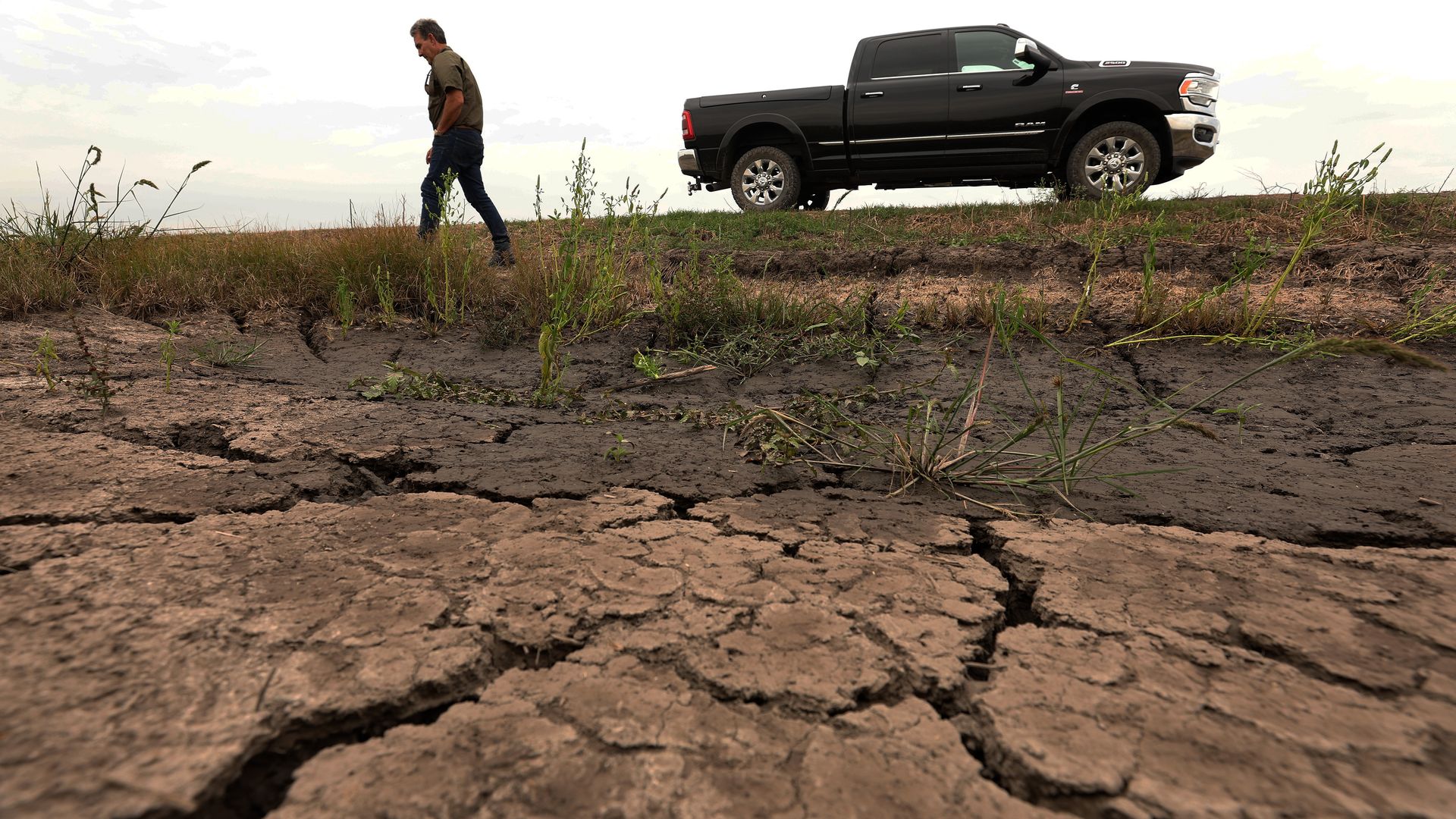 Photo shows dry cracked earth in what should be a crawfish farm.