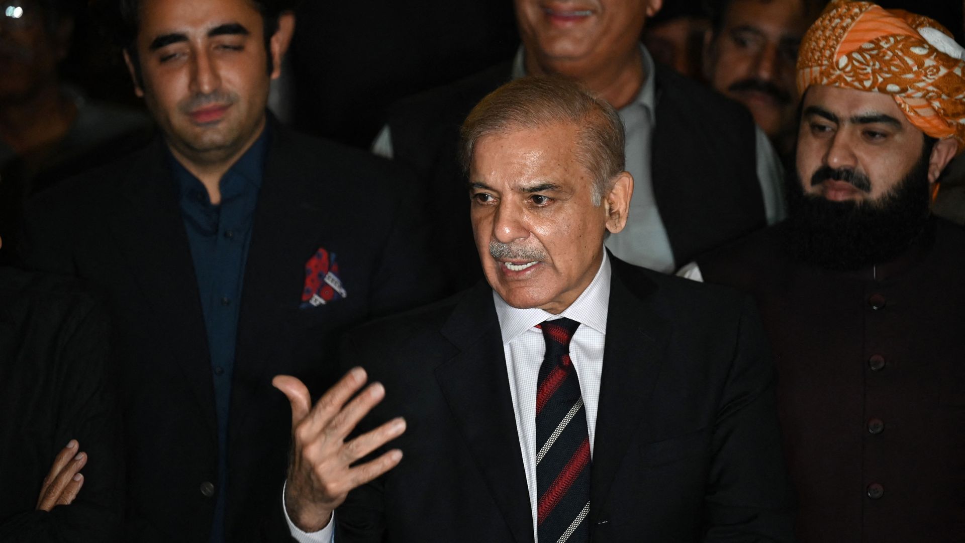 Pakistan's opposition leader Shahbaz Sharif (C) speaks