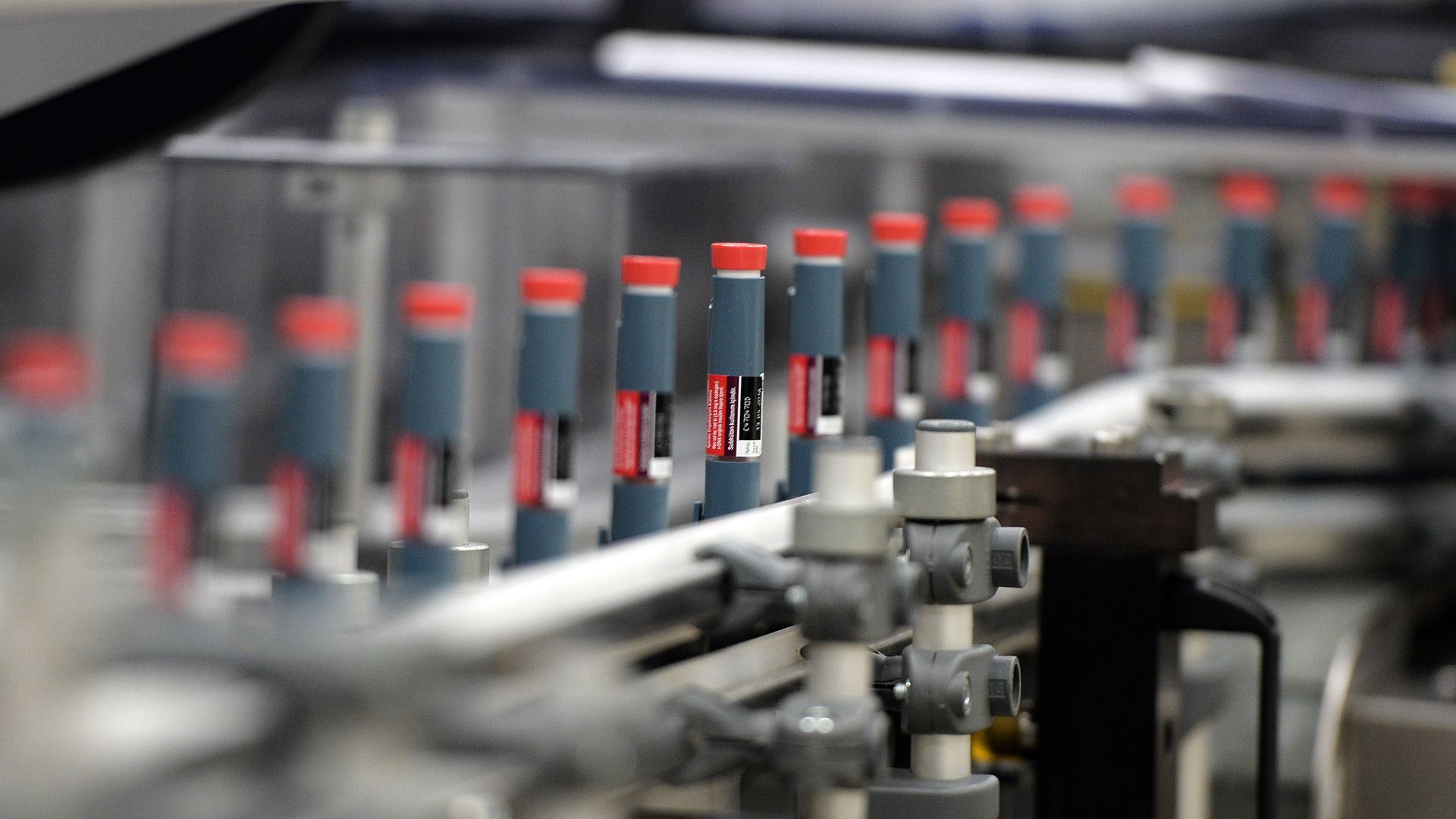 Insulin pens on an assembly line.