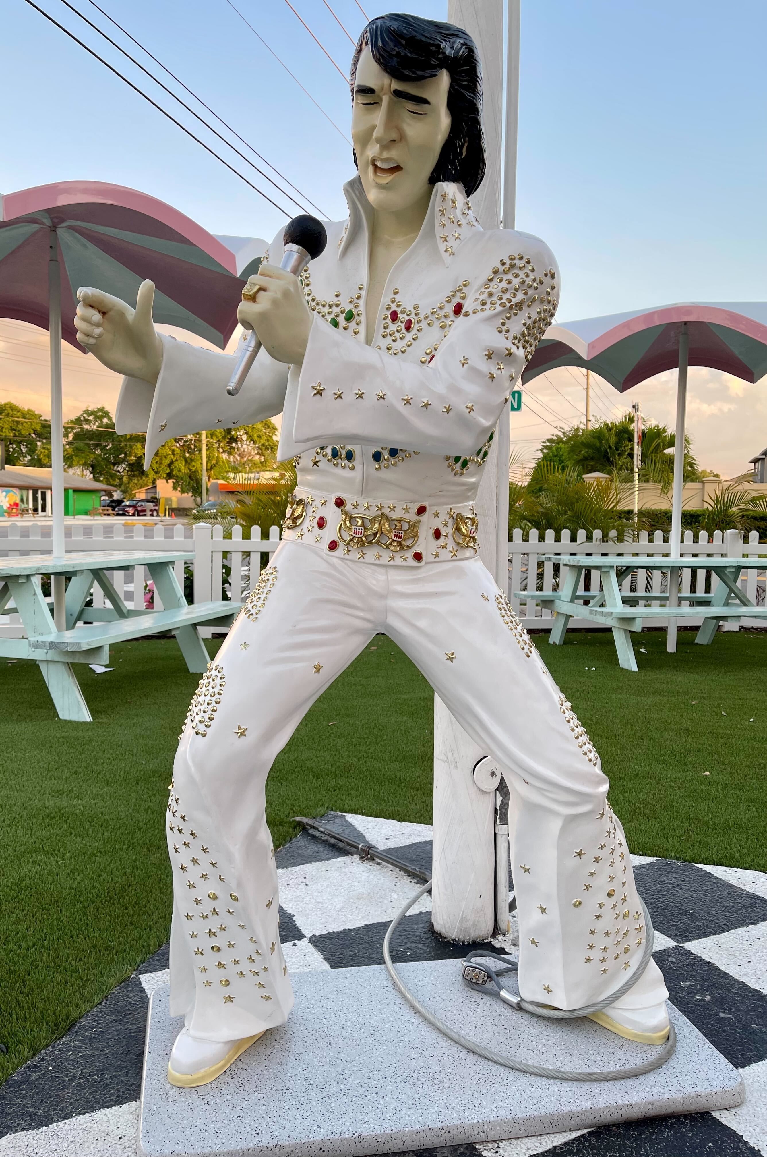 A statue of Elvis that looks more like Nic Cage