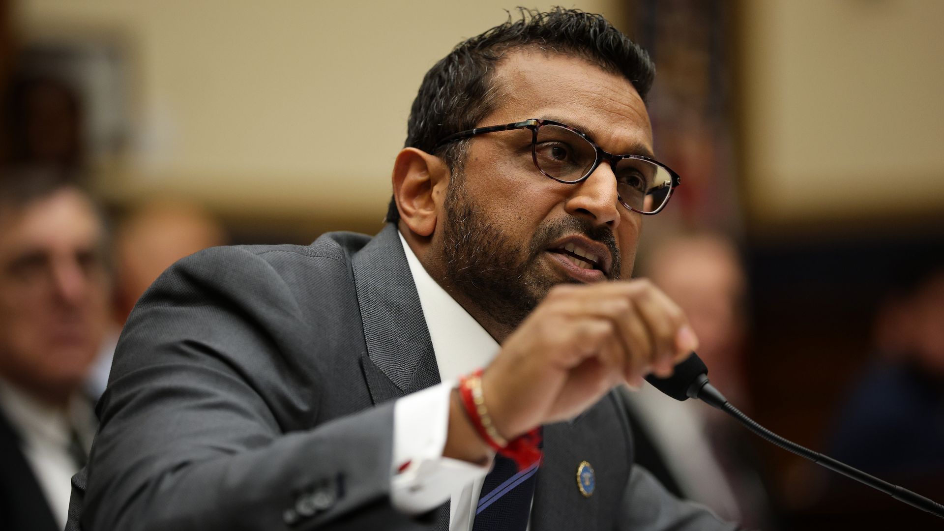 Kash Patel speaking into a microphone at a hearing