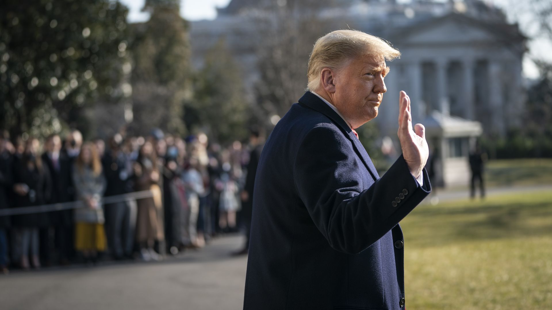 Picture of Donald Trump waiving at the crowd while walking