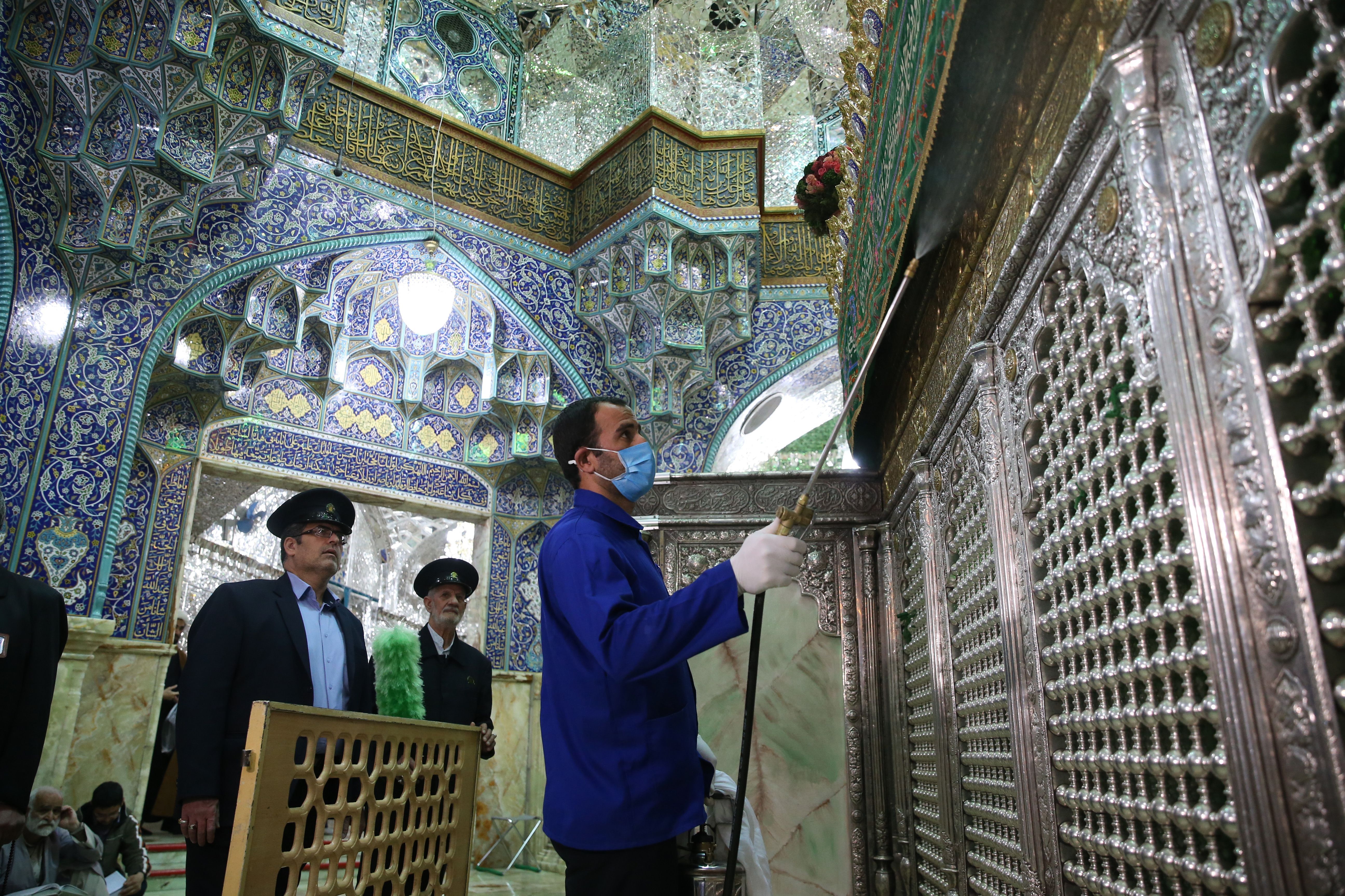  Iranian sanitary workers disinfect Qom's Masumeh shrine on February 25