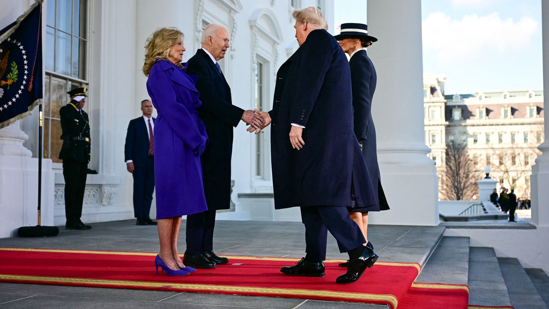 Former president Biden and President Trump shake hands