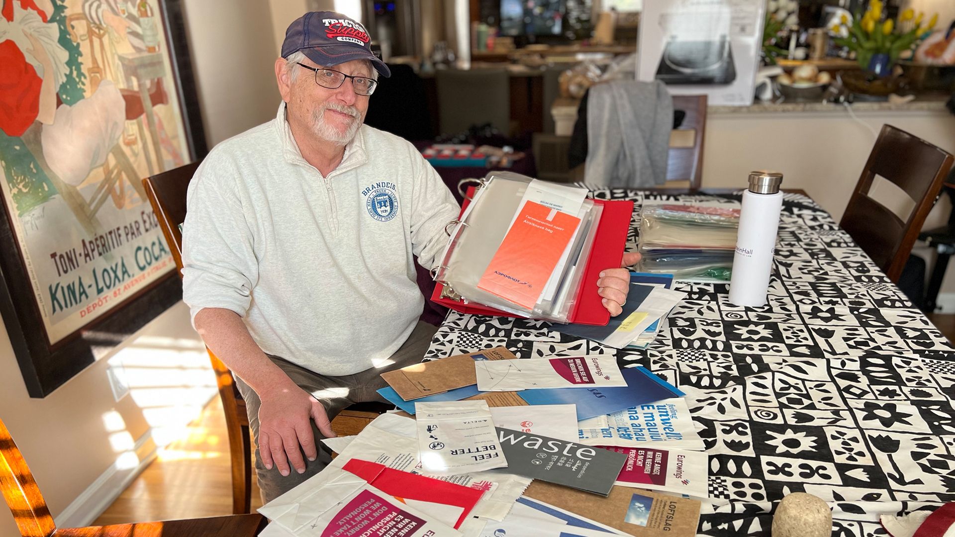 Lloyd Sobel and his collection of. air sickness bags.