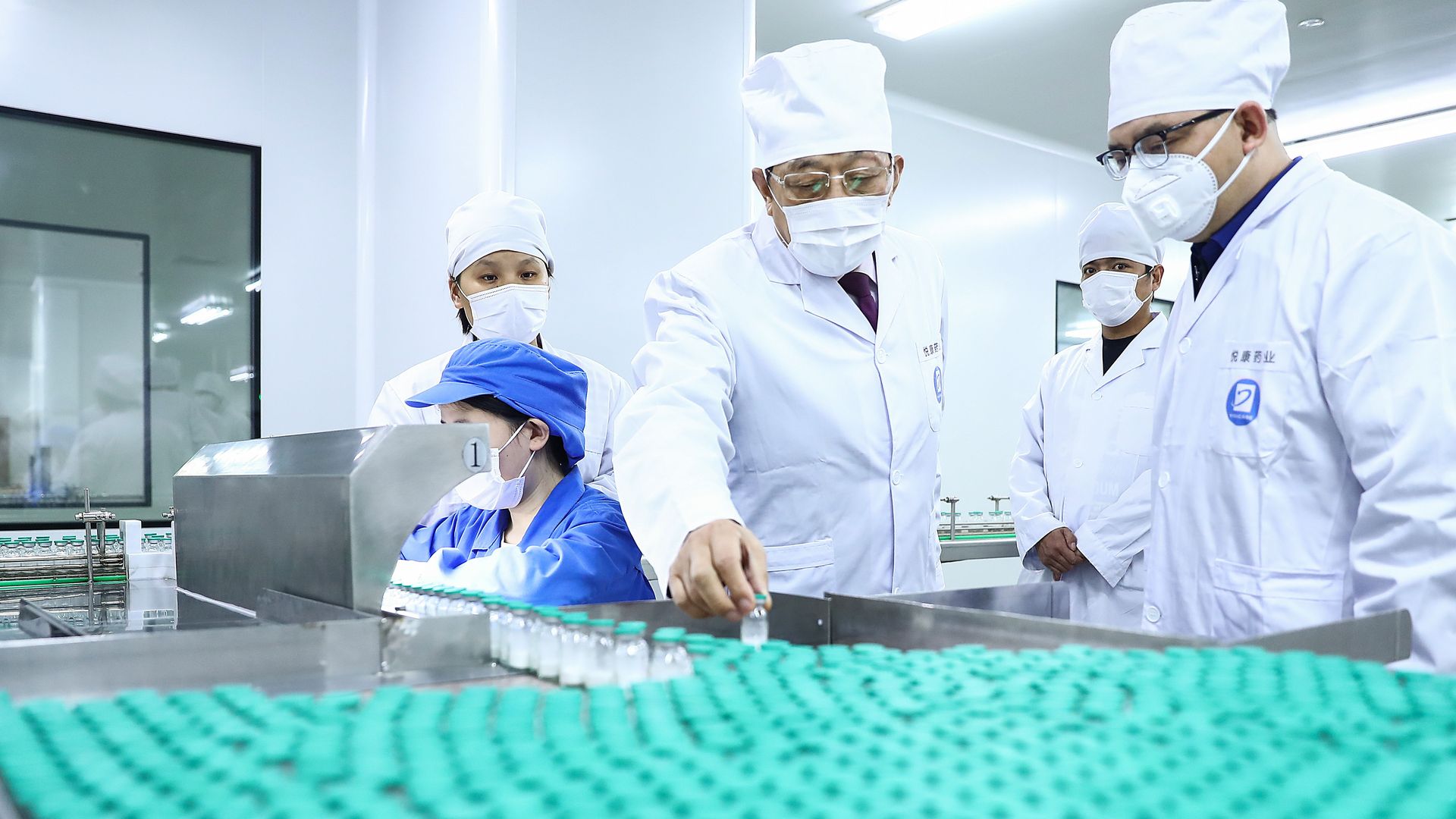  A management personnel checks the production of medicines