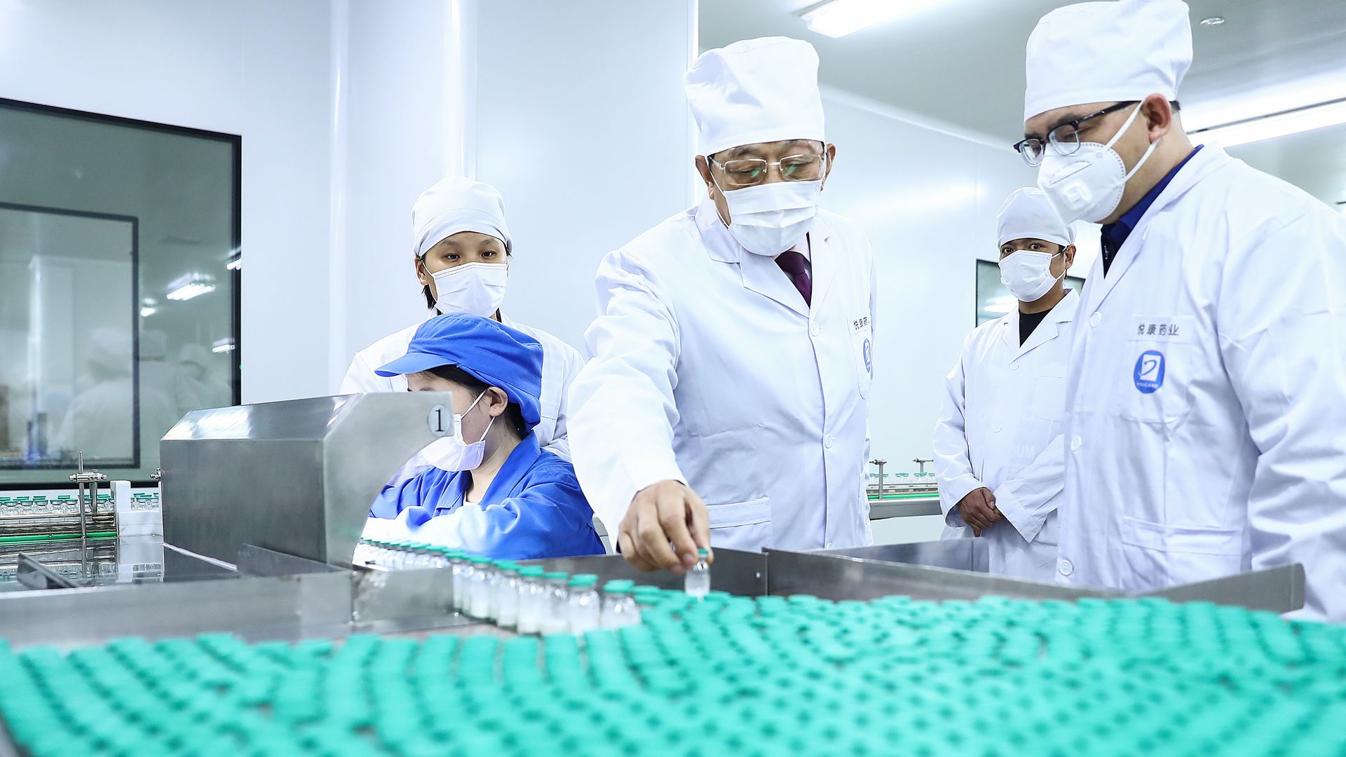 A management personnel checks the production of medicines