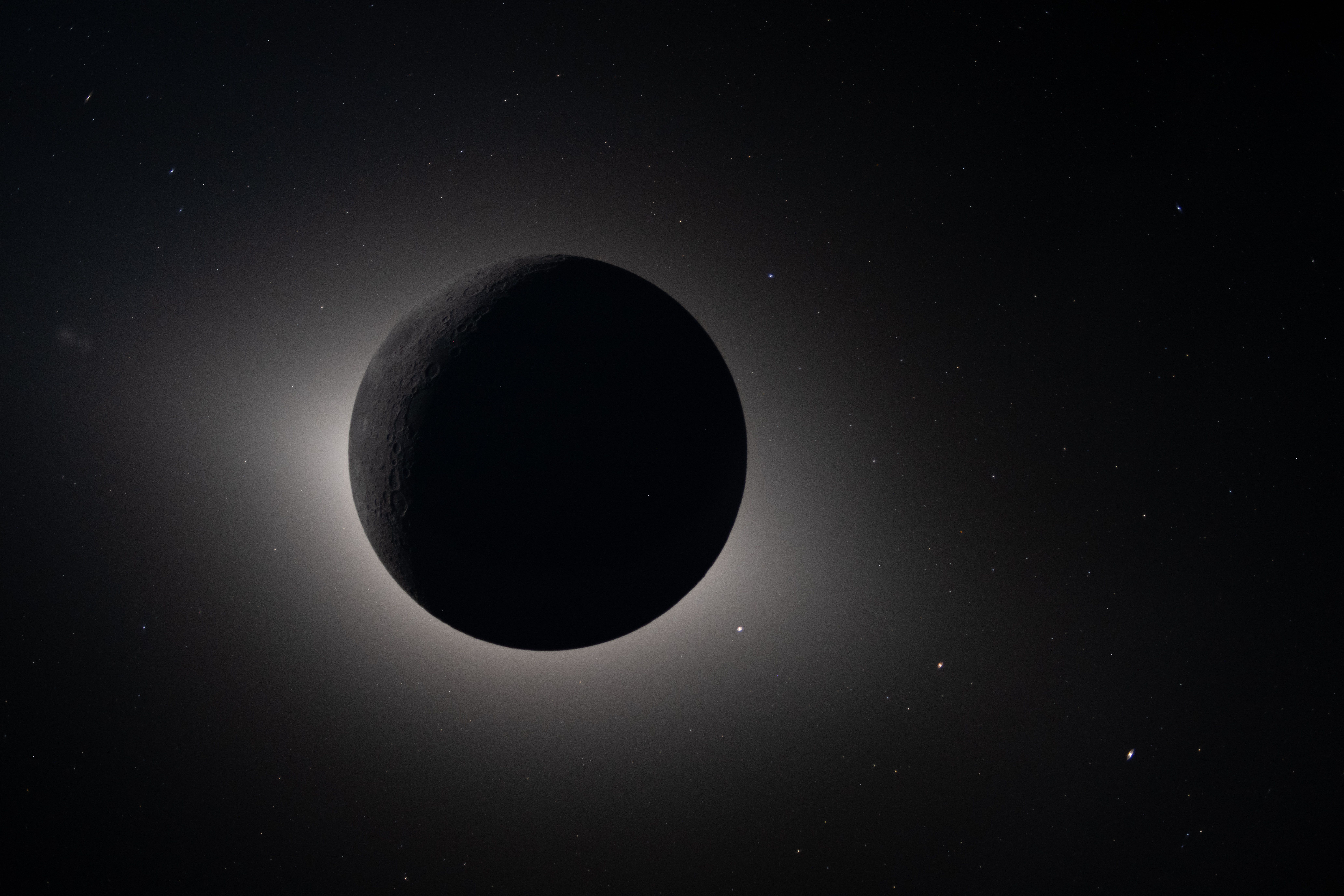 Captured by the Artemis II crew during their lunar flyby on April 6, 2026, this image shows the Moon fully eclipsing the Sun.