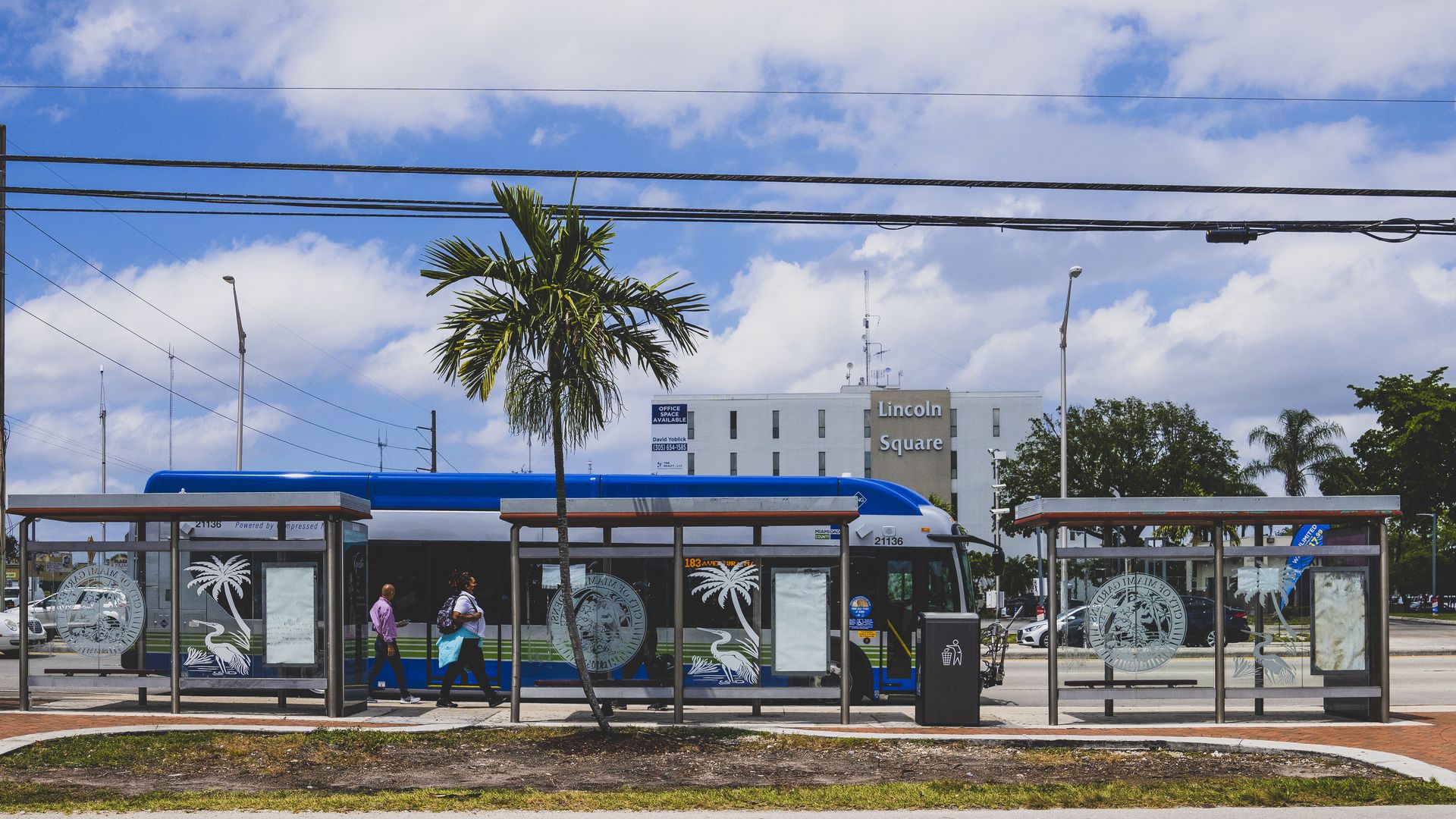 Commuters board a bus in the Miami Gardens neighborhood of Miami, Florida, U.S., on Monday, April 12, 2021. The U.S. economy is on a multi-speed track as minorities in some cities find themselves left behind by the overall boom in hiring, according to a Bloomberg analysis of about a dozen metro area