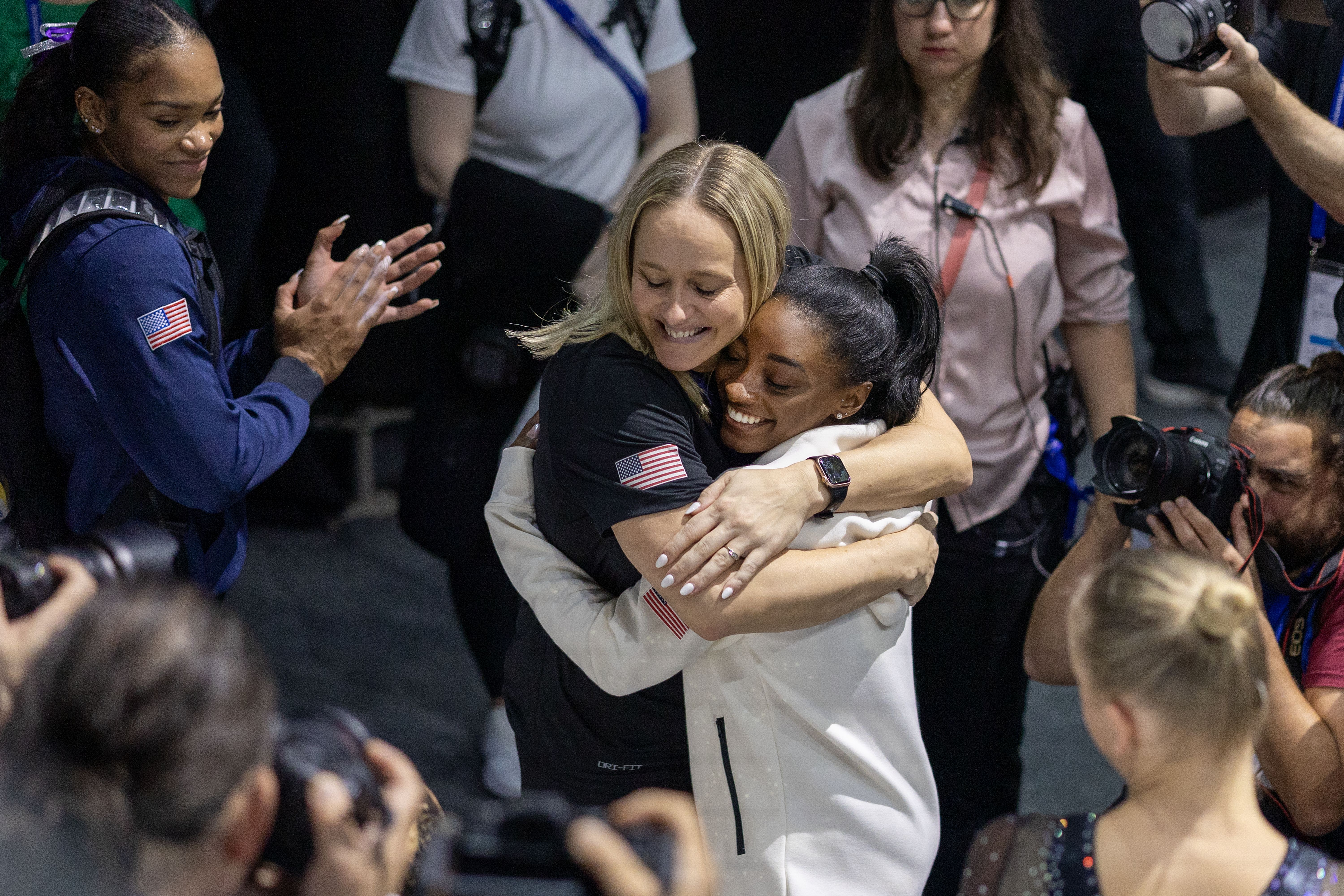 Simone Biles of the United States is embraced by coach Cécile Canqueteau-Landi after her balance beam routine during her gold medal win in the Women's Balance Beam Final at the Artistic Gymnastics World Championships-Antwerp 2023 at the Antwerp Sportpaleis on October 8th, 2023 in Antwerp, Belgium. 