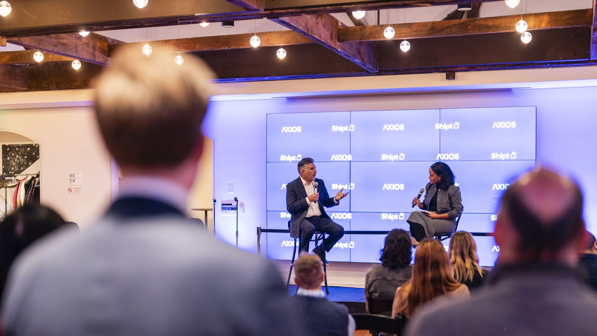 Rep. Tony Cárdenas (D-Calif.) speaking to Axios economics reporter Courtenay Brown at an event. Photo credit: Eric Lee for Axios.