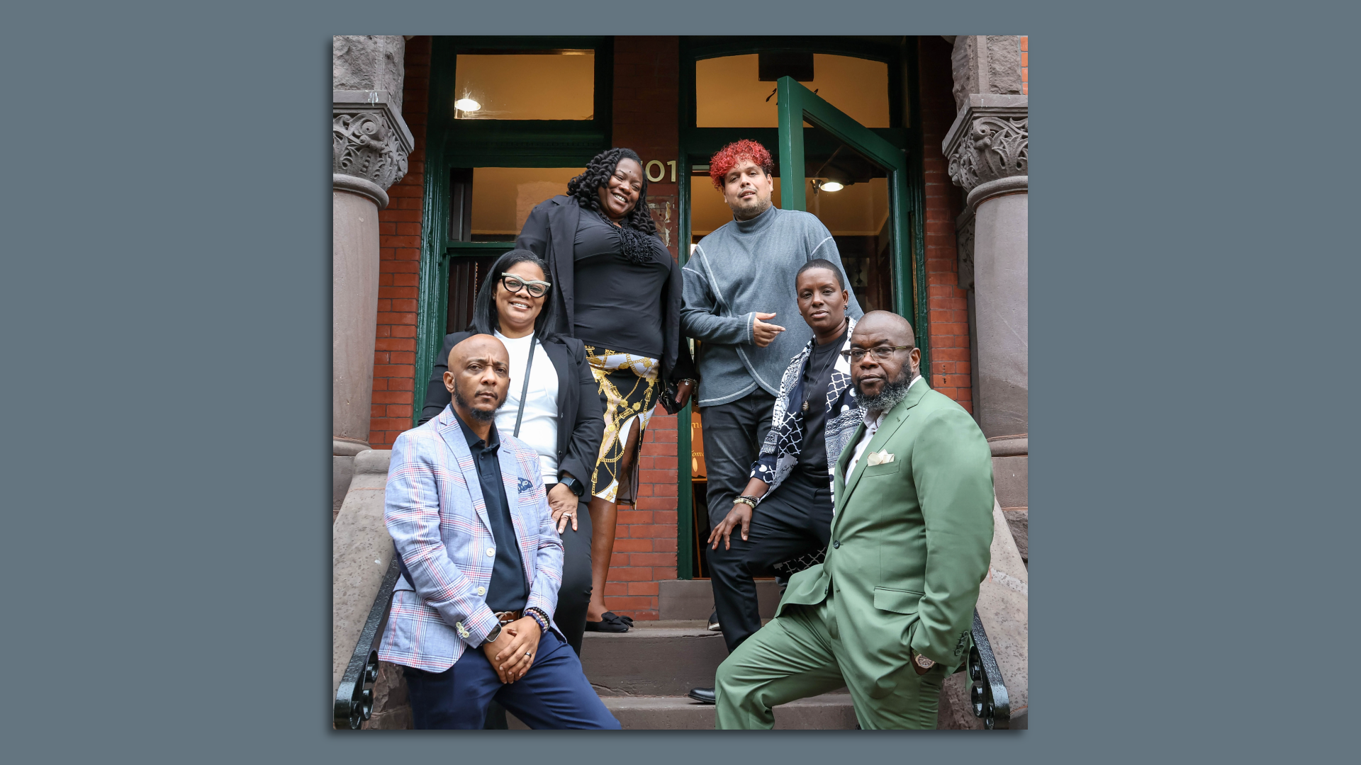 Six people on the steps of new LGBTQ+ center Destination Tomorrow in DC