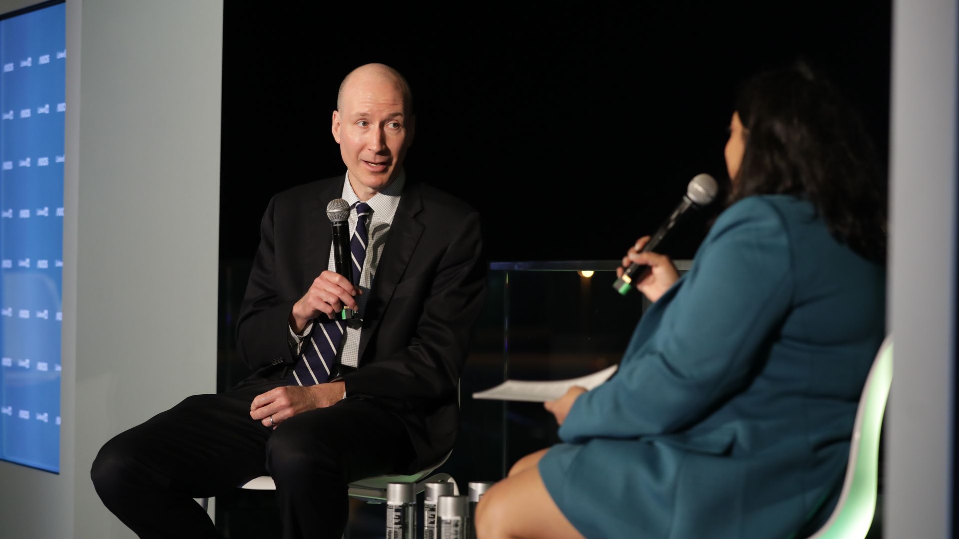 David Turk talks to Niala Boodhoo at an Axios panel in Dubai
