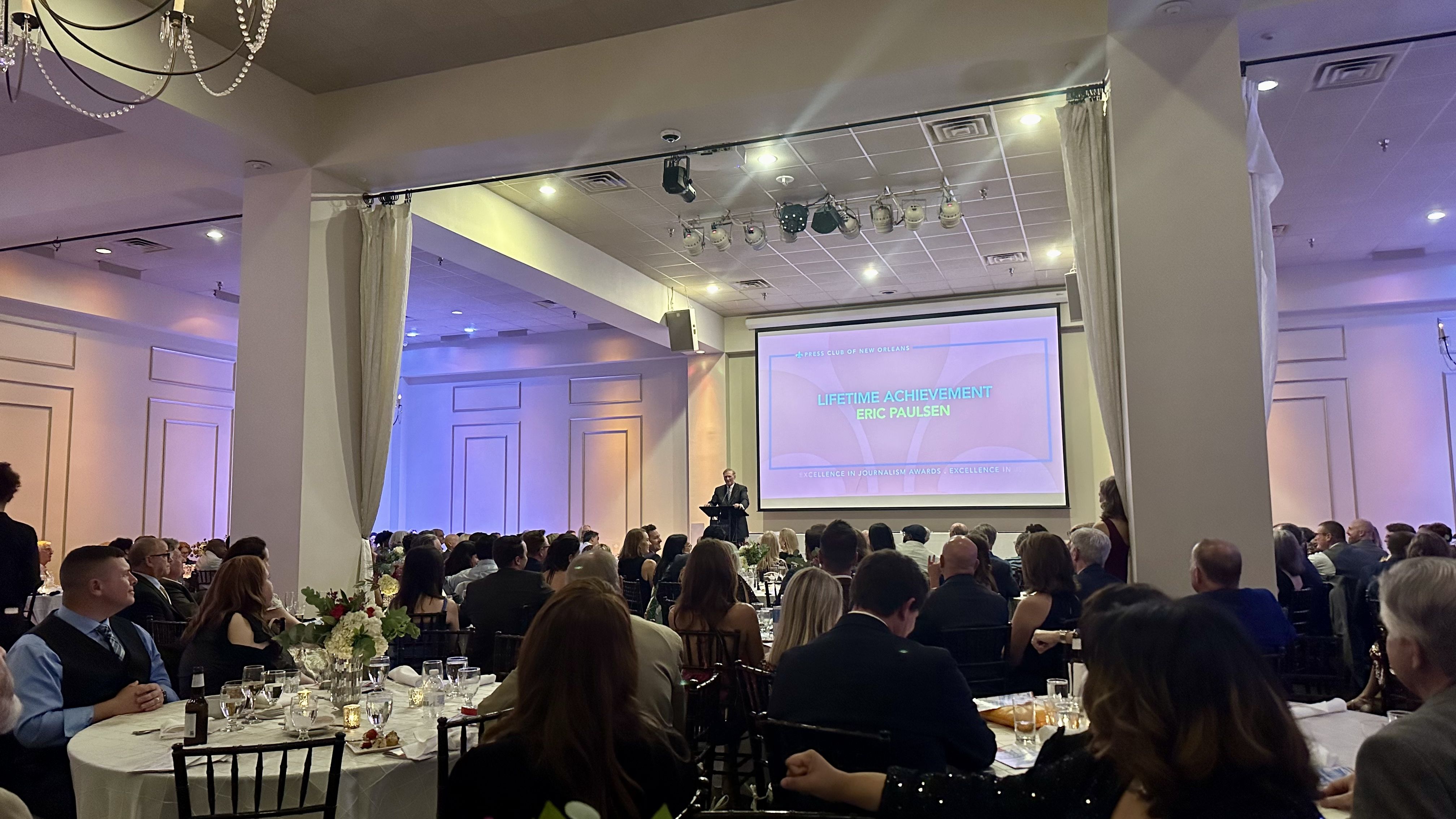 Photo shows Eric Paulsen on stage