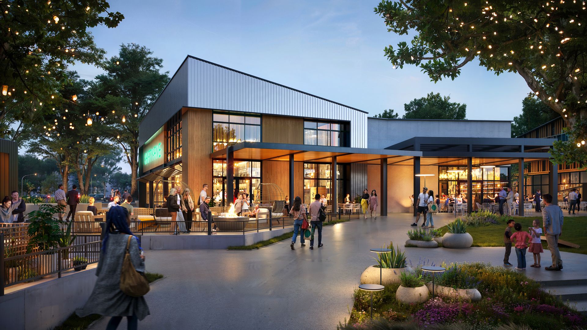 Evening scene at a modern outdoor shopping plaza: wood-and-metal building, string lights in trees, people at outdoor tables, a central fire pit, and landscaped planters.