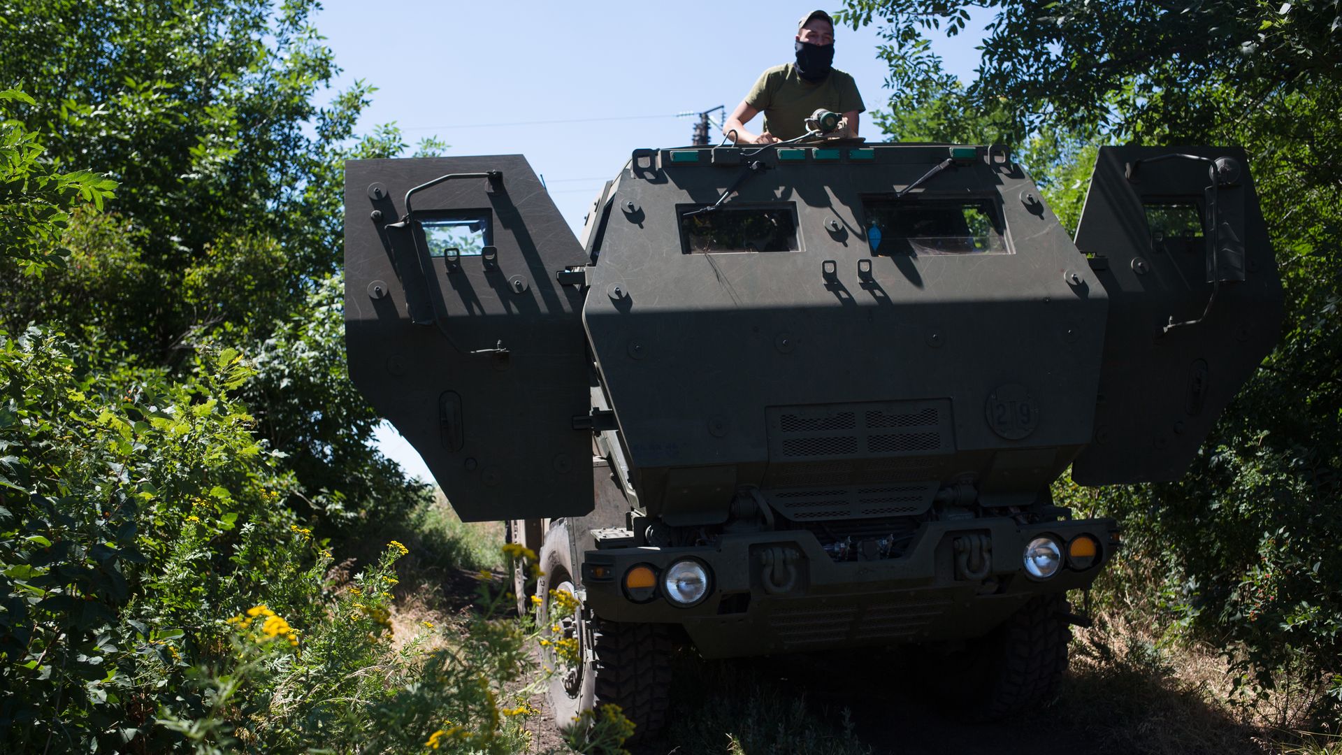 A Ukrainian serviceman as seen on a HIMARS on July 1 in eastern Ukraine.